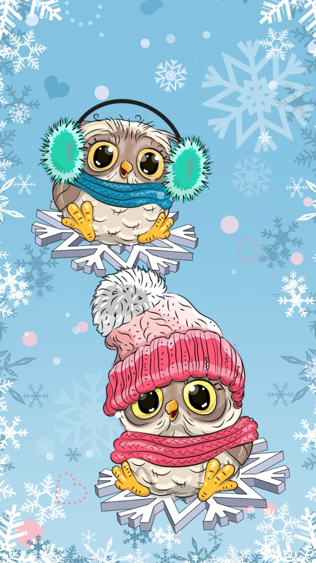 Two small owls in a pink hat and blue scarf sit on large white snowflakes against a soft blue winter sky.