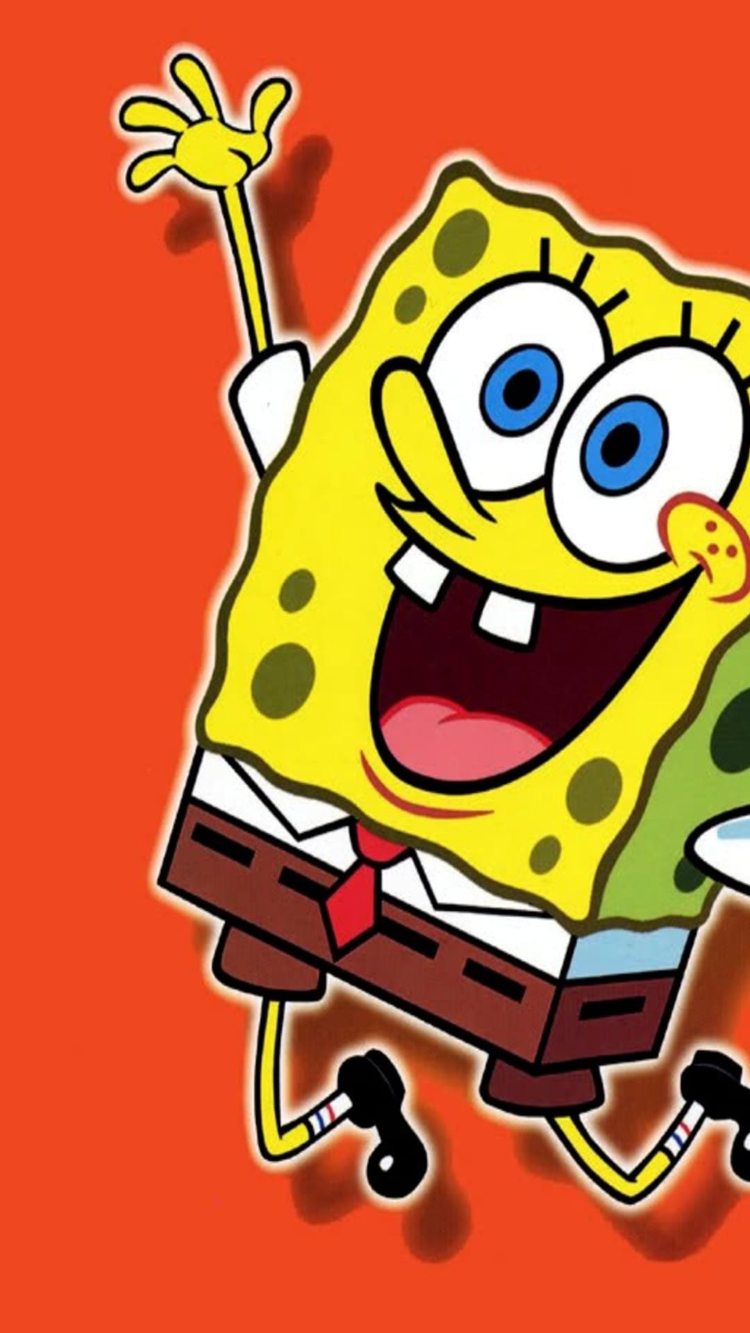 SpongeBob SquarePants smiles joyfully with large blue eyes against a solid orange background in portrait.