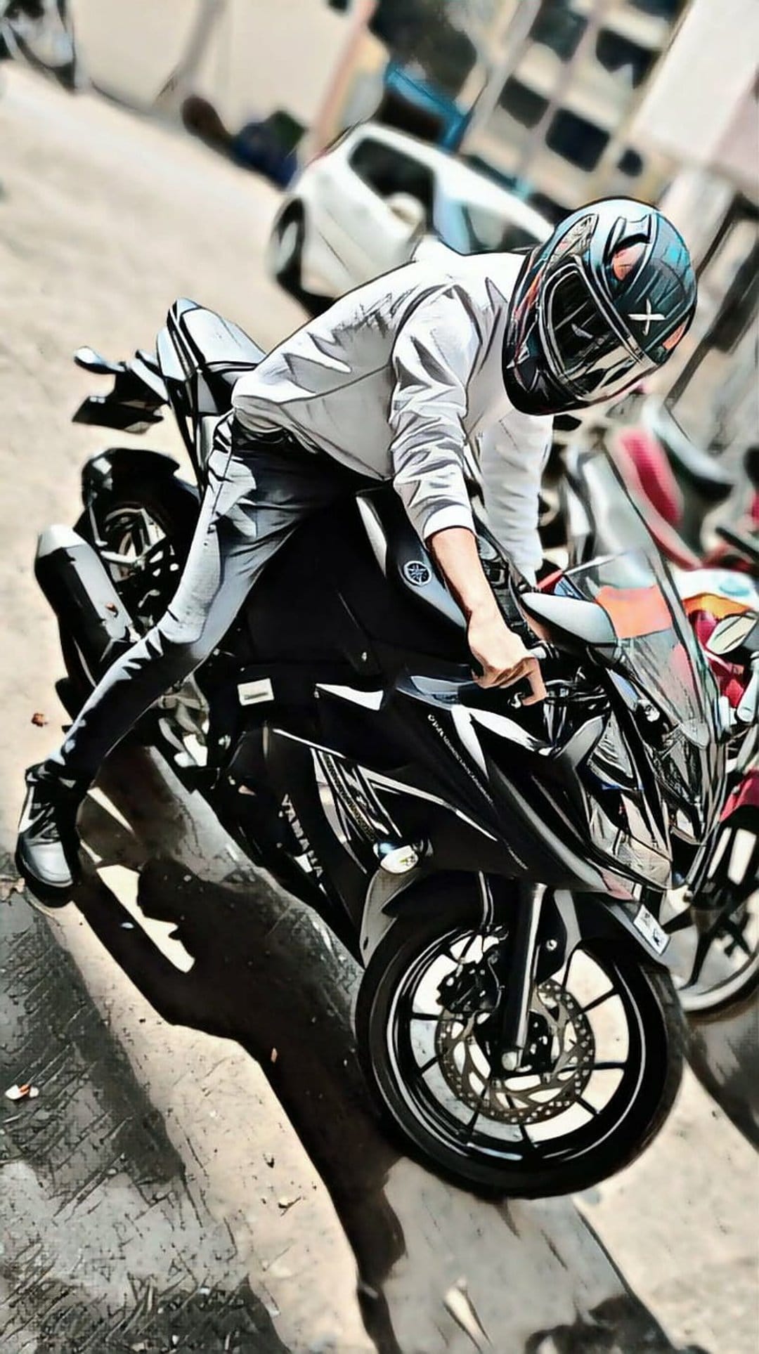 Biker in a black helmet poses on a Yamaha sportbike with a blurred background showing speed and motion.