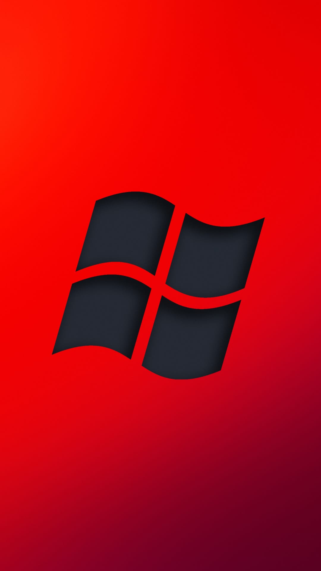 Windows logo in dark gray with a red glow centered on a vibrant red to deep purple gradient background.