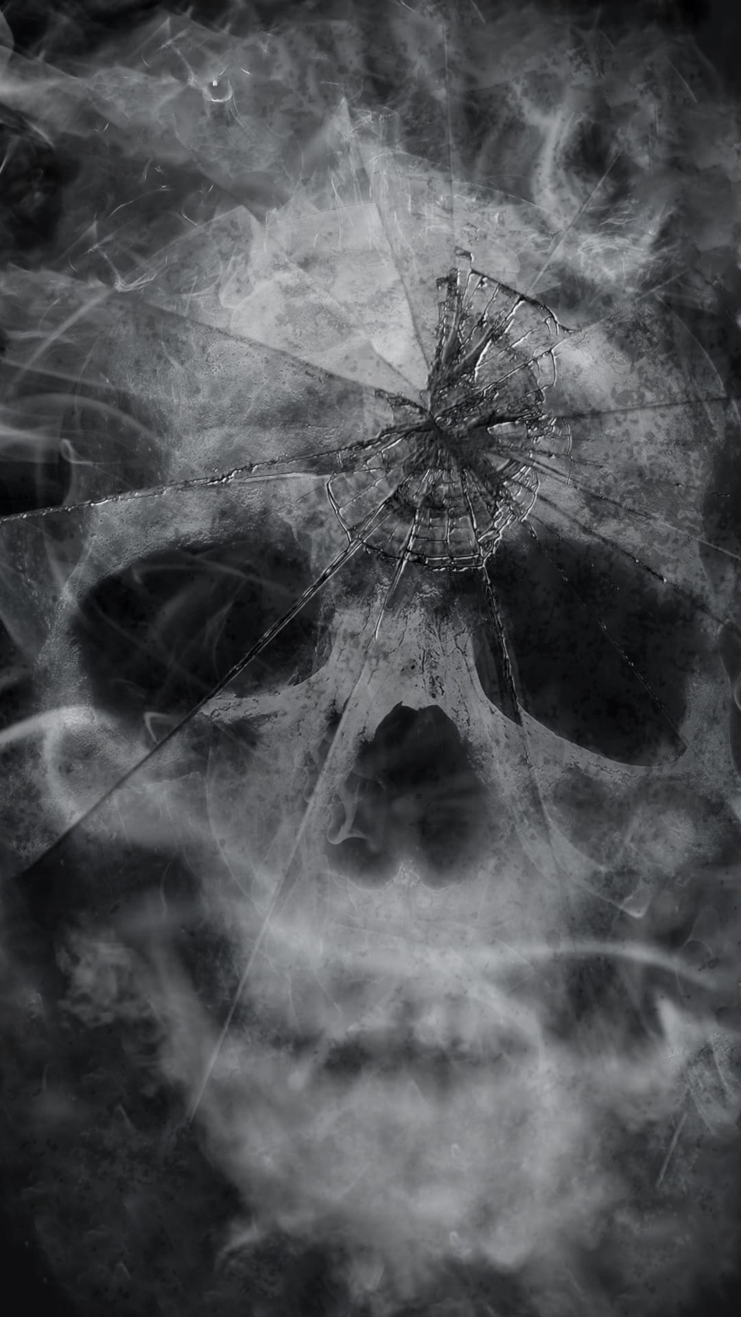 Skeletal skull shape composed of jagged broken glass and swirling gray vapor against a dark backdrop.