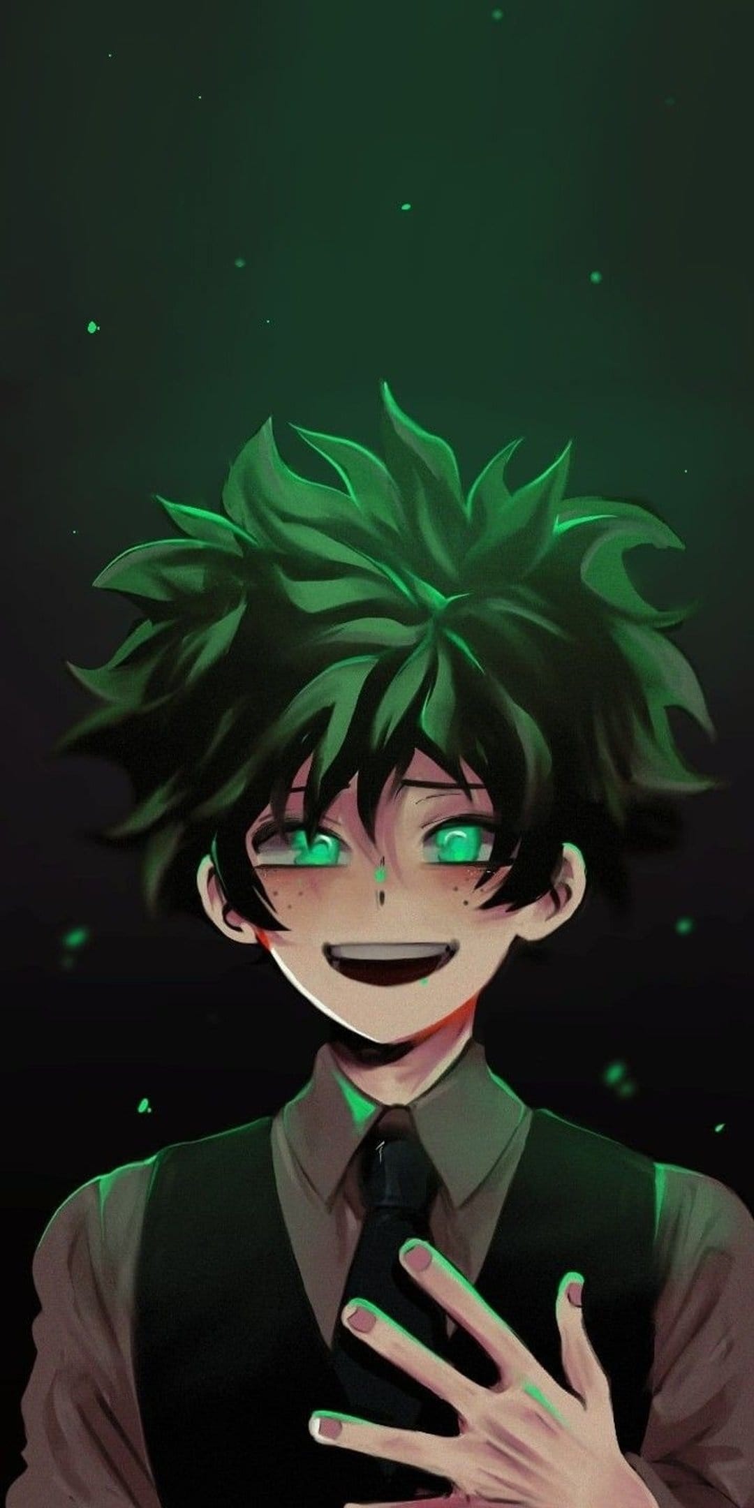 Young boy with spiky green hair, freckles, and glowing emerald eyes wearing a vest against a dark background.