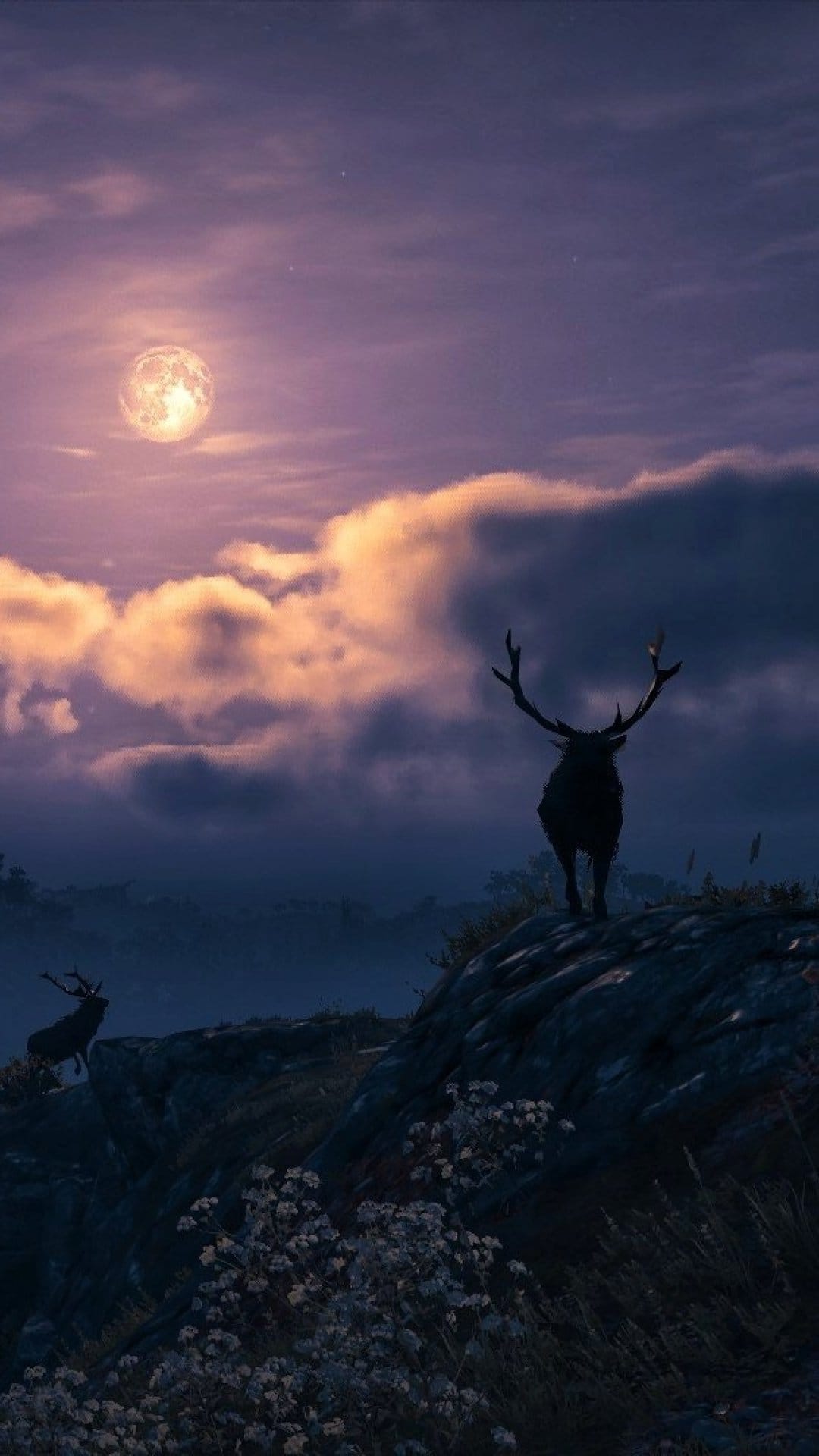 Majestic stag silhouette on a rocky cliff against a large glowing full moon and purple clouds at night.