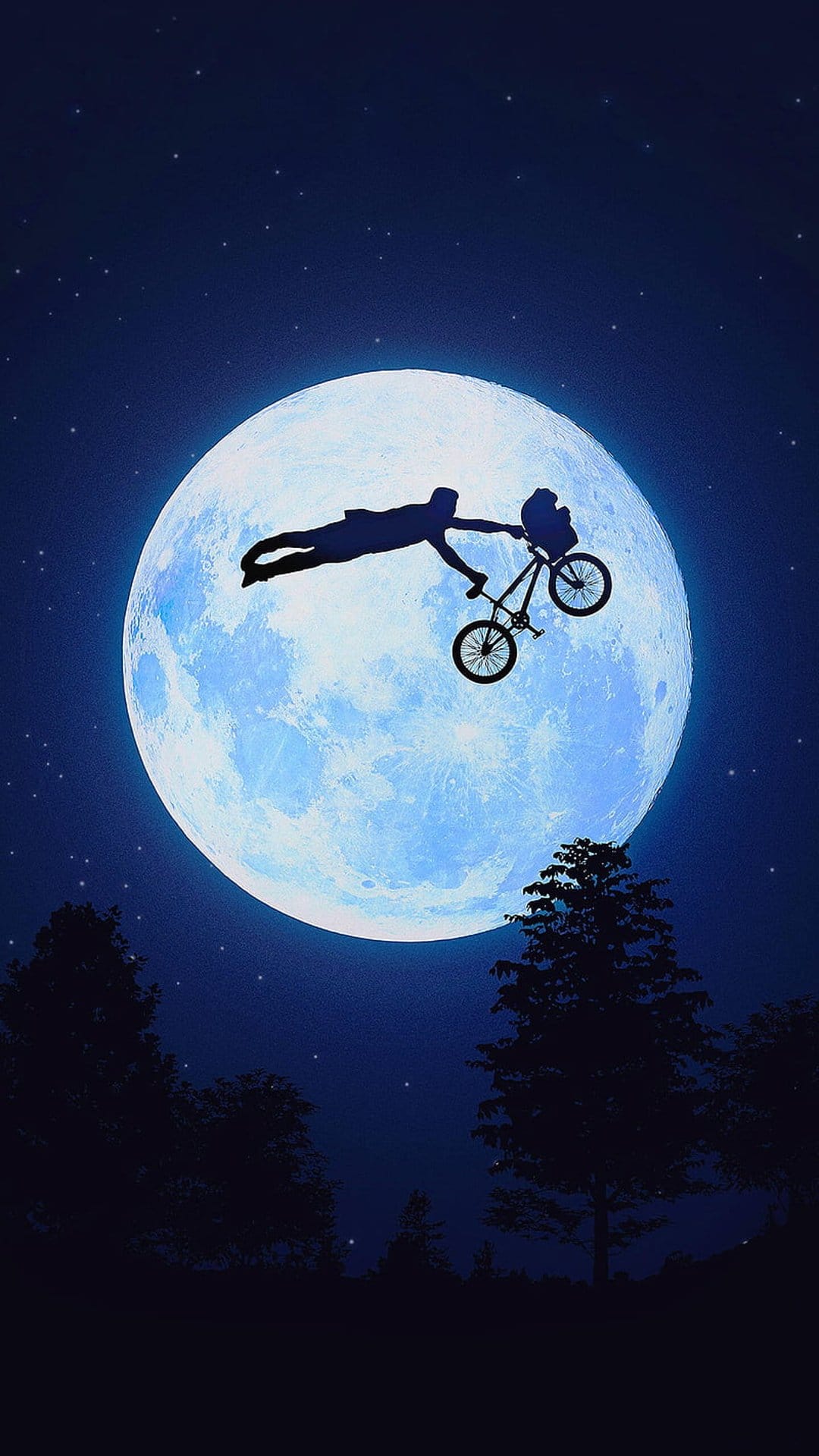 Elliot and E.T. on a bicycle silhouetted against a huge glowing moon and starry night sky with pine trees.