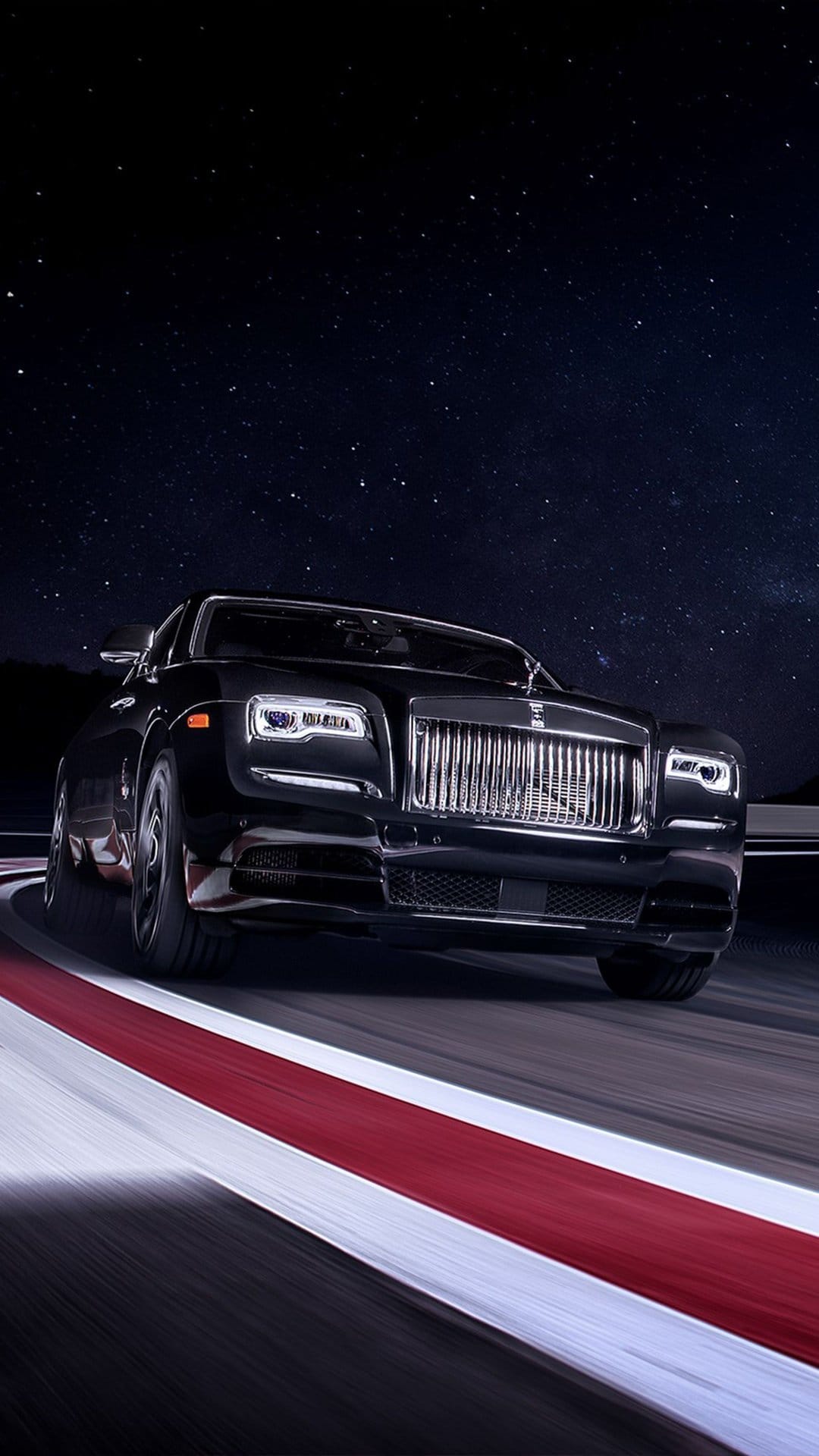 Black luxury car driving on a track at night under a starry sky with motion blurred road curbs.