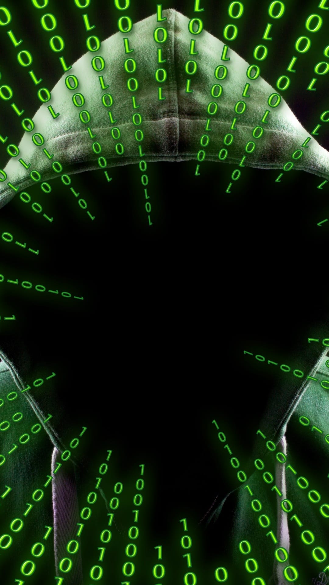Hooded figure stands obscured by glowing green vertical binary code falling against a dark black background.