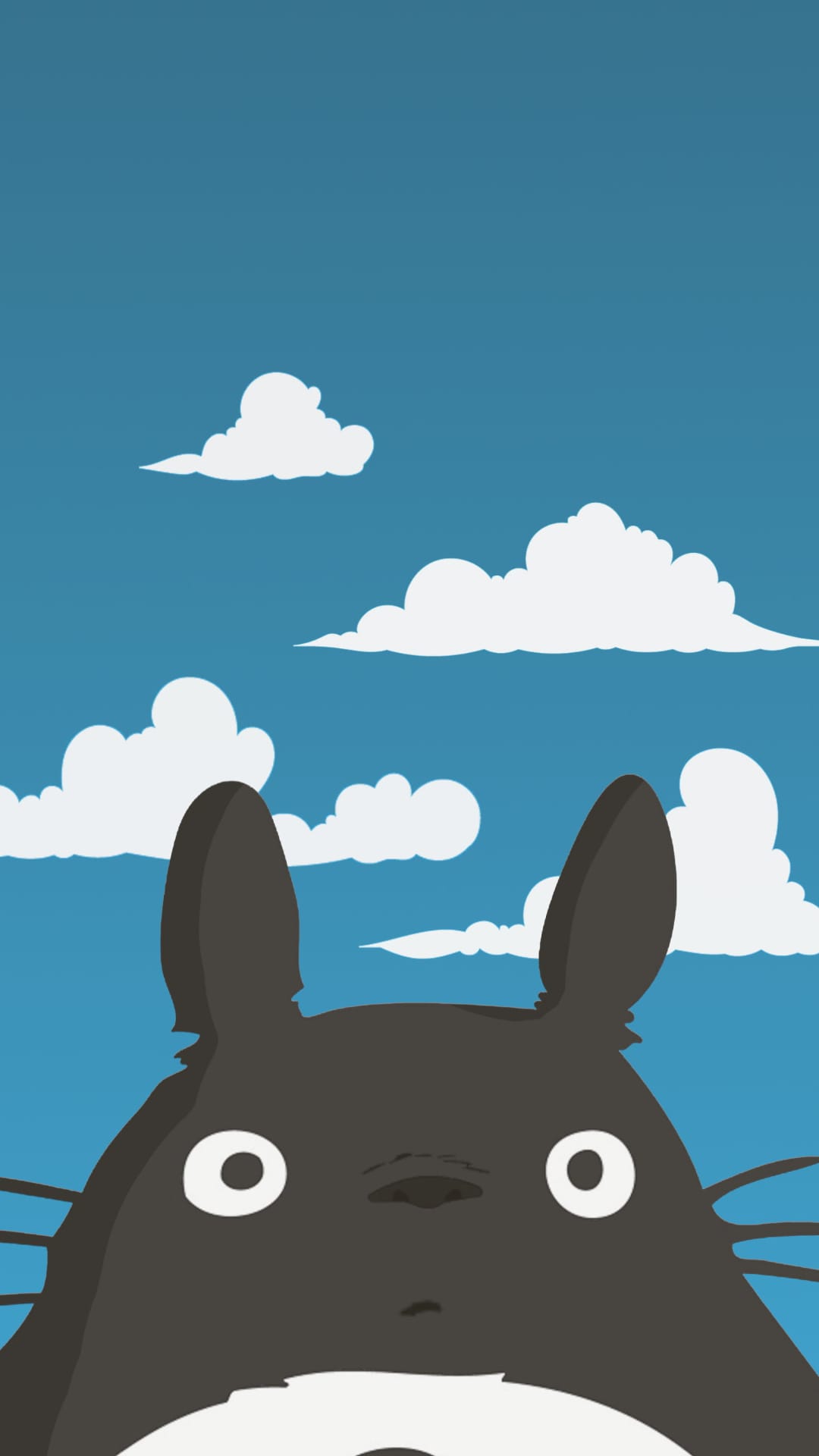 Totoro peeks over a bottom edge with wide eyes under a bright blue sky filled with white fluffy clouds.