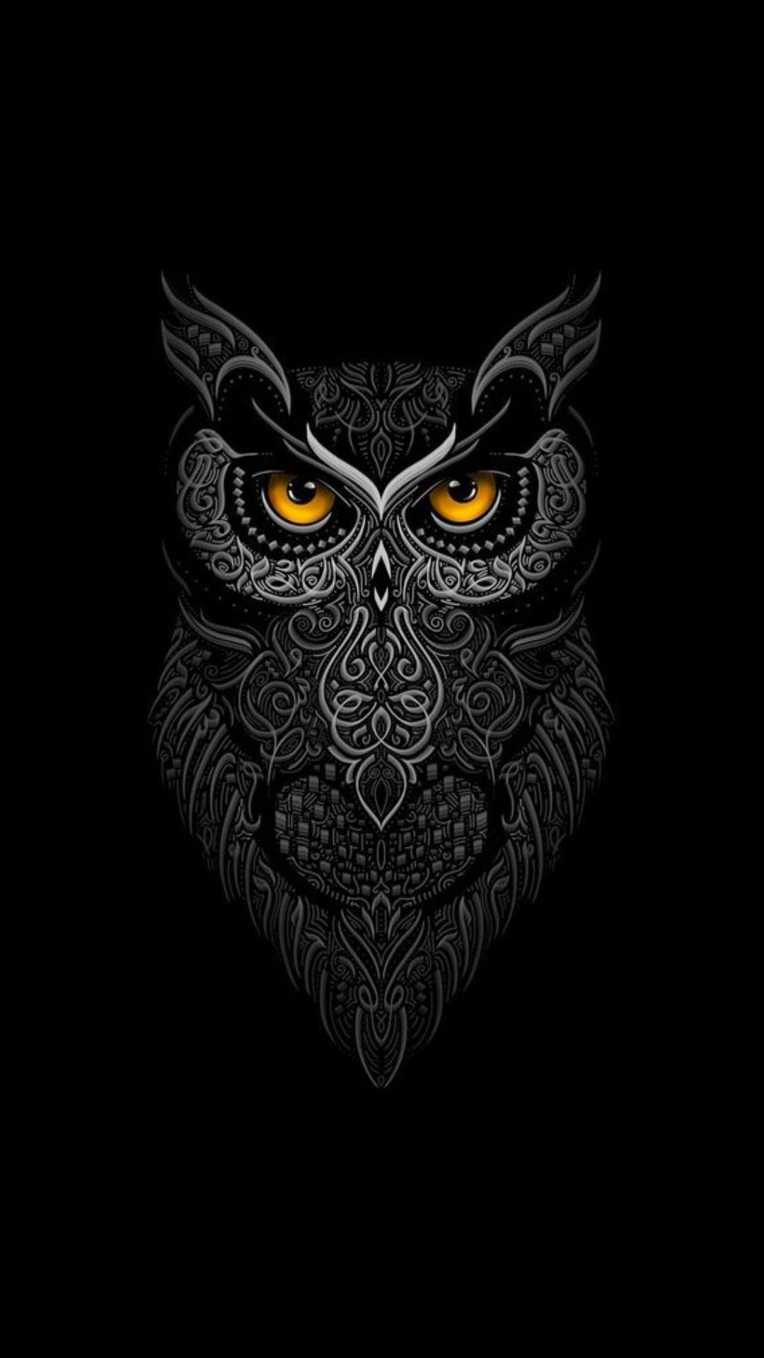 Owl face featuring intricate gray tribal engravings and bright yellow eyes staring forward on a black background.