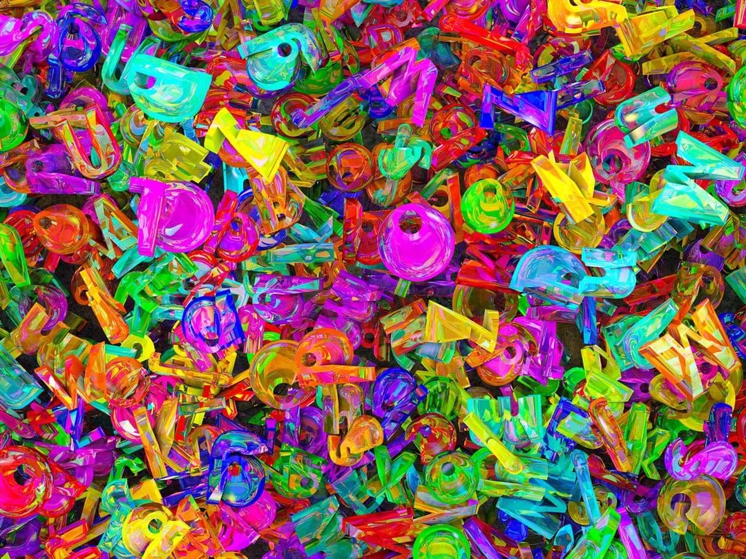 Translucent pink, blue, and green plastic musical notes and guitars in a glossy, top-down pile with soft lighting.