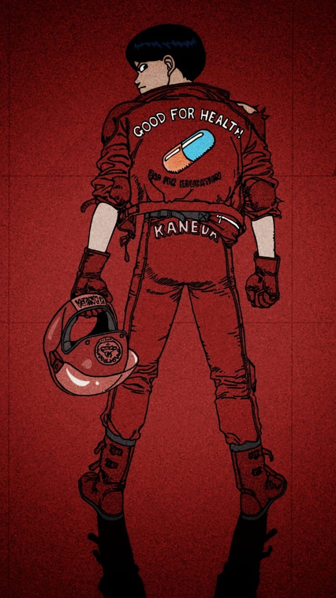 Shotaro Kaneda stands from behind wearing a red motorcycle jacket with a pill logo and holding a helmet.