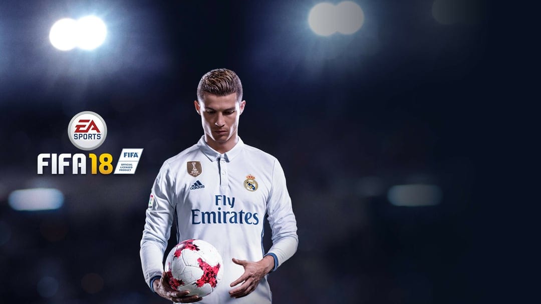 Cristiano Ronaldo in a white jersey holding a football under bright stadium lights for a FIFA 18 game cover.