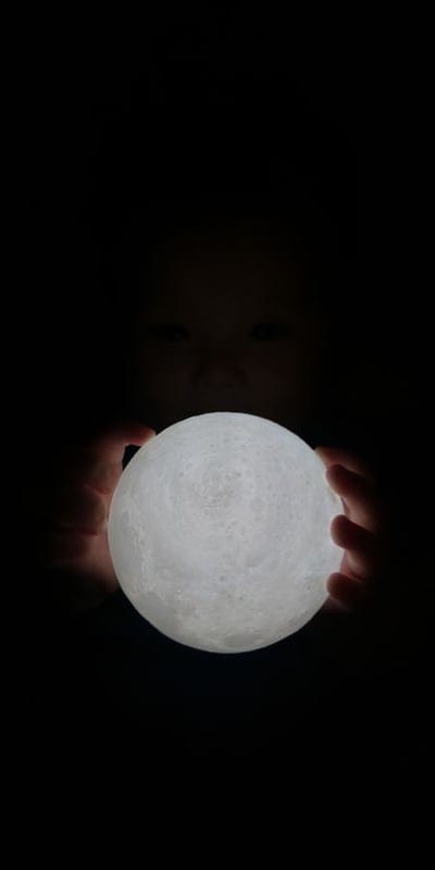 Moon, Child, Hands, Glow, Dark, Mystery, Wonder, Luminous, Secret, Warmth, Peaceful, Serene, Imagination, Gentle, Light, Orb, Sphere, Intimate, Enchanting, Night