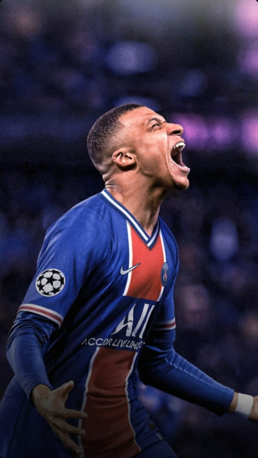Kylian Mbappe shouts in celebration wearing a blue PSG kit with the Champions League badge on his sleeve.