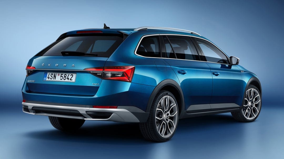 Blue Skoda Superb Scout 4x4 estate car from a rear angle on a gradient blue studio backdrop with soft lighting.