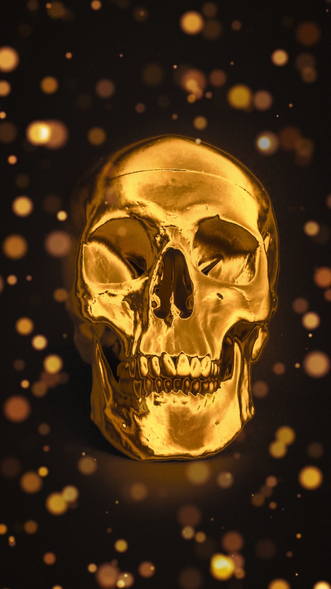Polished golden skull centered against a dark background with soft yellow bokeh light circles and deep shadows.