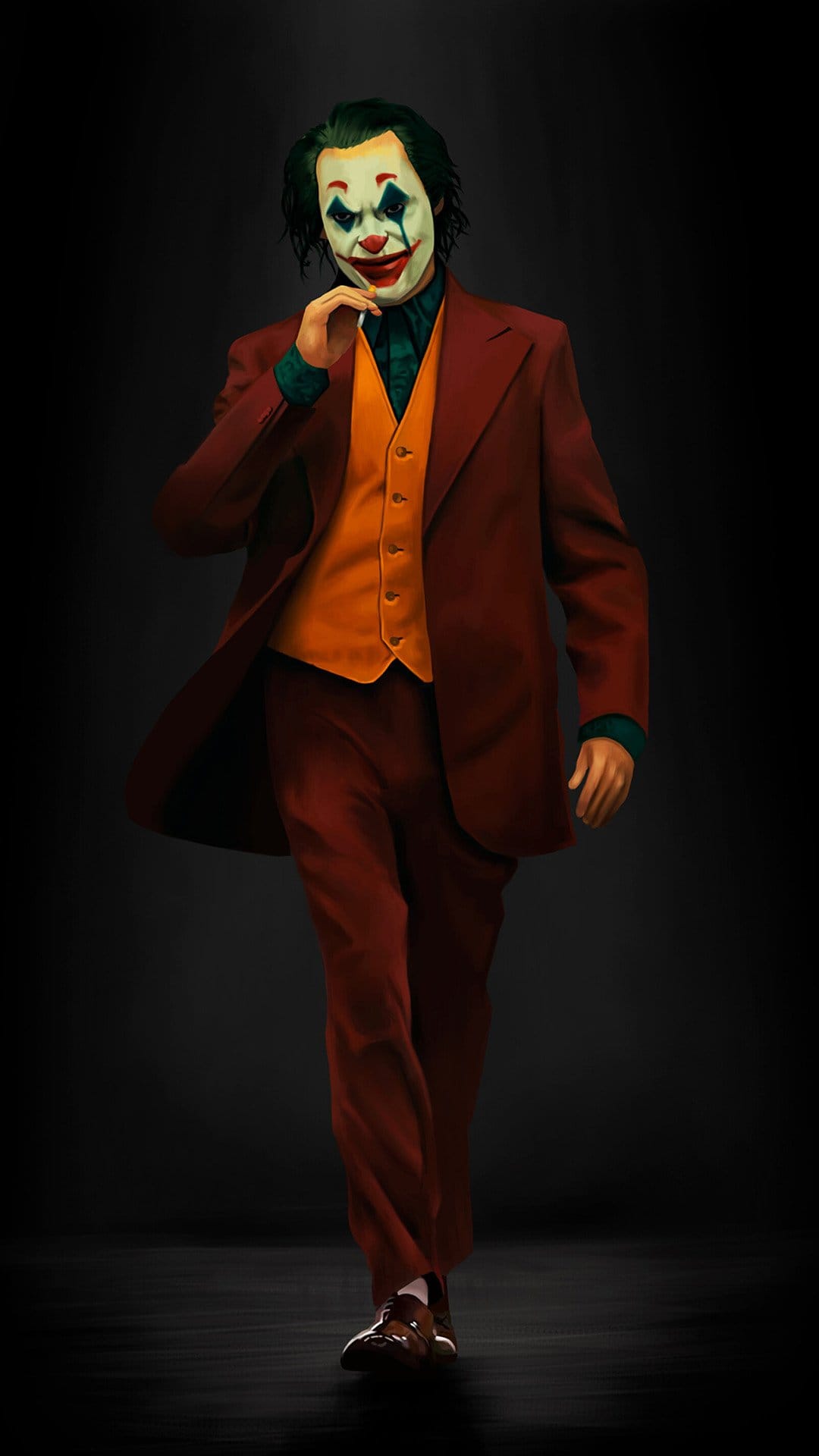 Arthur Fleck as Joker walks forward with a hand on his chin against a dark, shadowy, minimalist background.