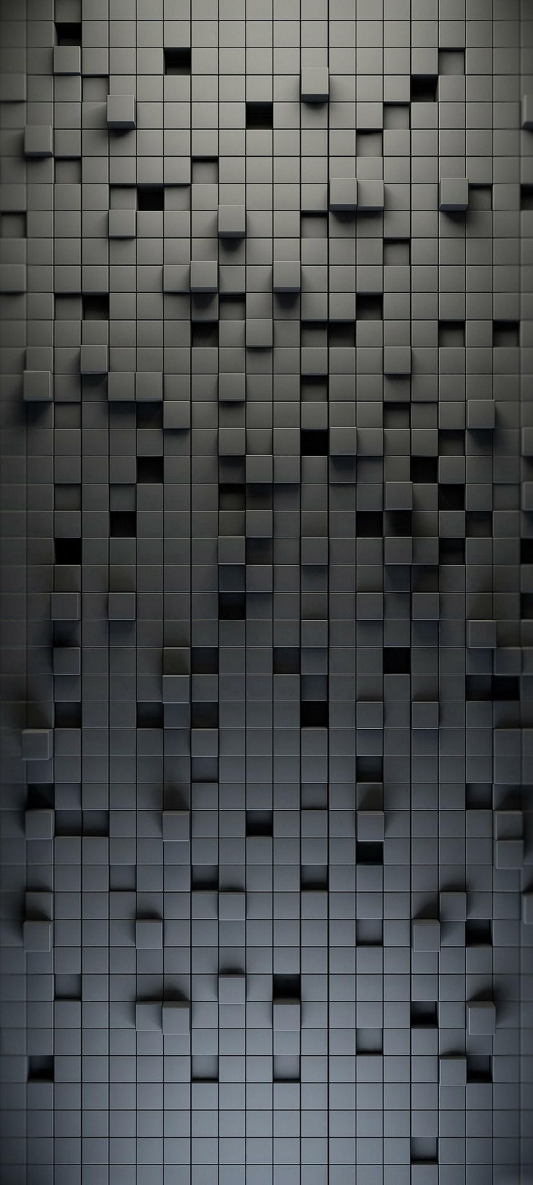 Dark gray geometric cubes protruding from a flat surface with soft shadows creating a 3D architectural texture.
