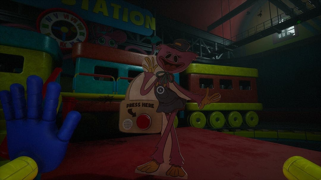 Pink Kissy Missy cutout stands near a blue GrabPack hand in a dark industrial station with colorful toy trains.
