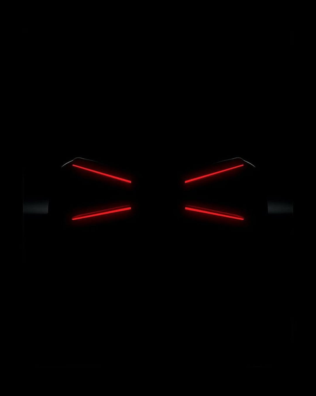 Red neon light beams forming a geometric bow tie shape against a dark, minimalist black background.