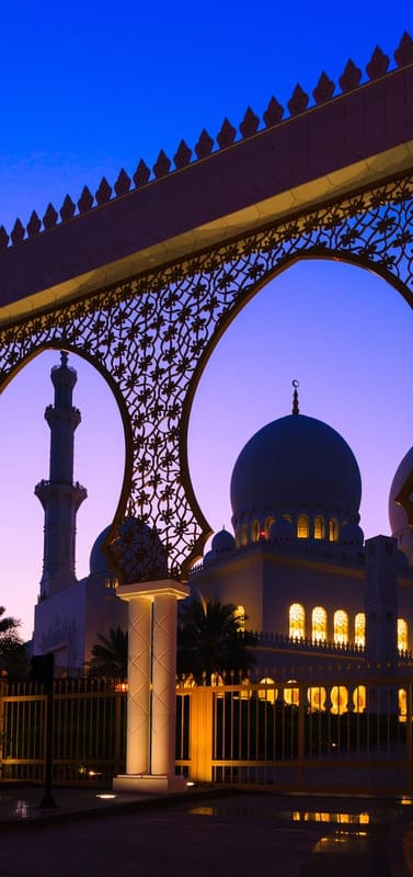 Sheikh Zayed Mosque, Abu Dhabi, mosque, Islamic architecture, sunset, dusk, minaret, dome, archway, golden, ornate, serene, beautiful, Middle East, travel, landmark, spiritual, grand, religious site, night, illumination