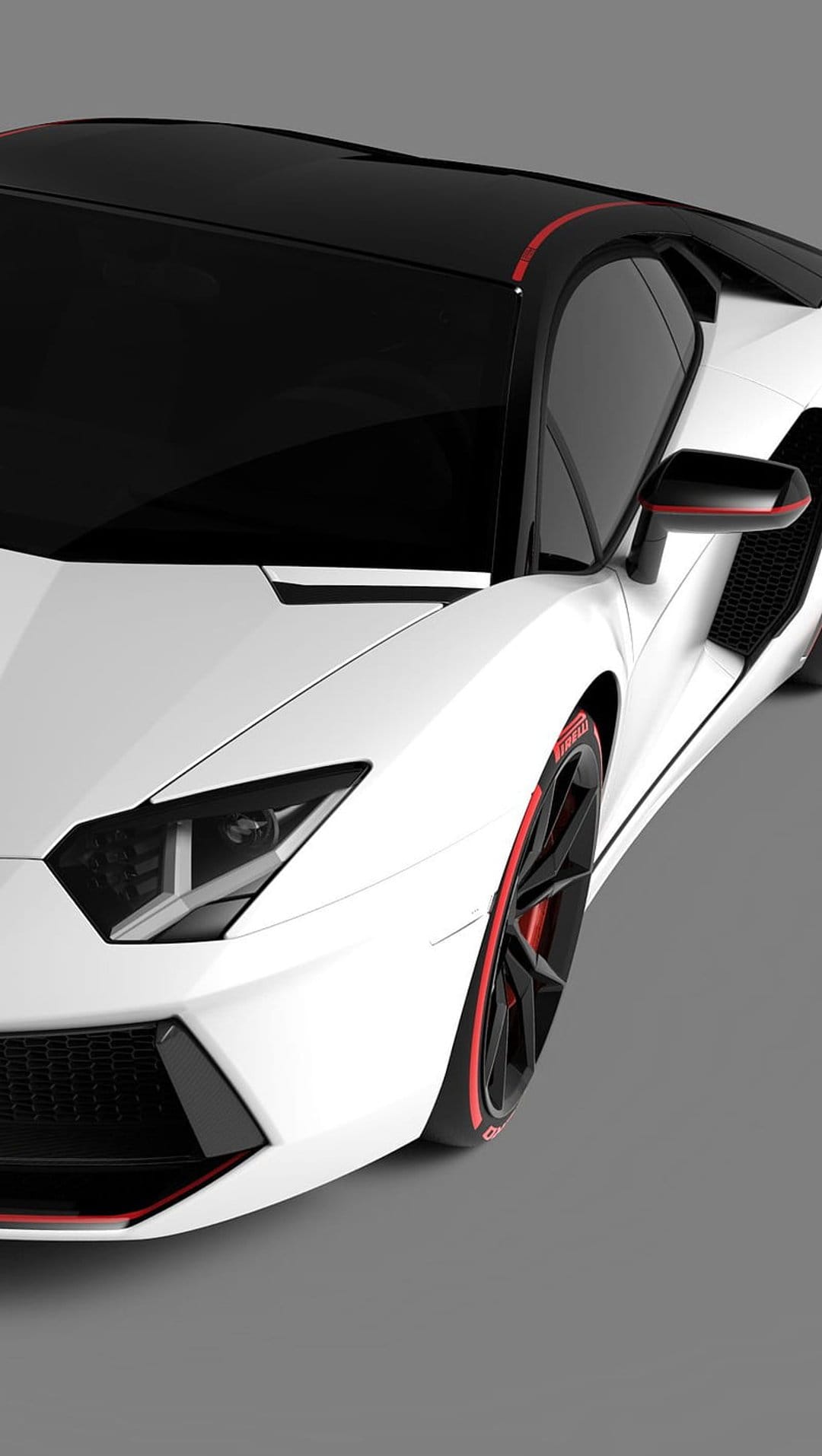 White Lamborghini sports car with red wheel accents and black roof parked in a high-detail close-up view.