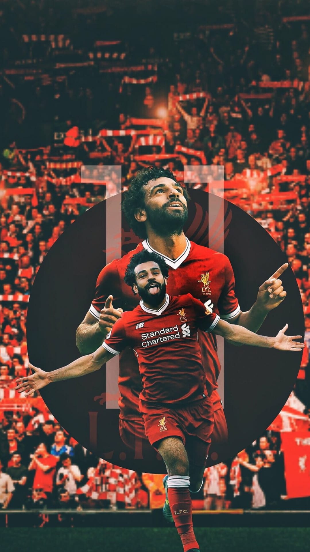 Mohamed Salah raises his arms in celebration wearing a red Liverpool kit in front of a blurred stadium crowd.