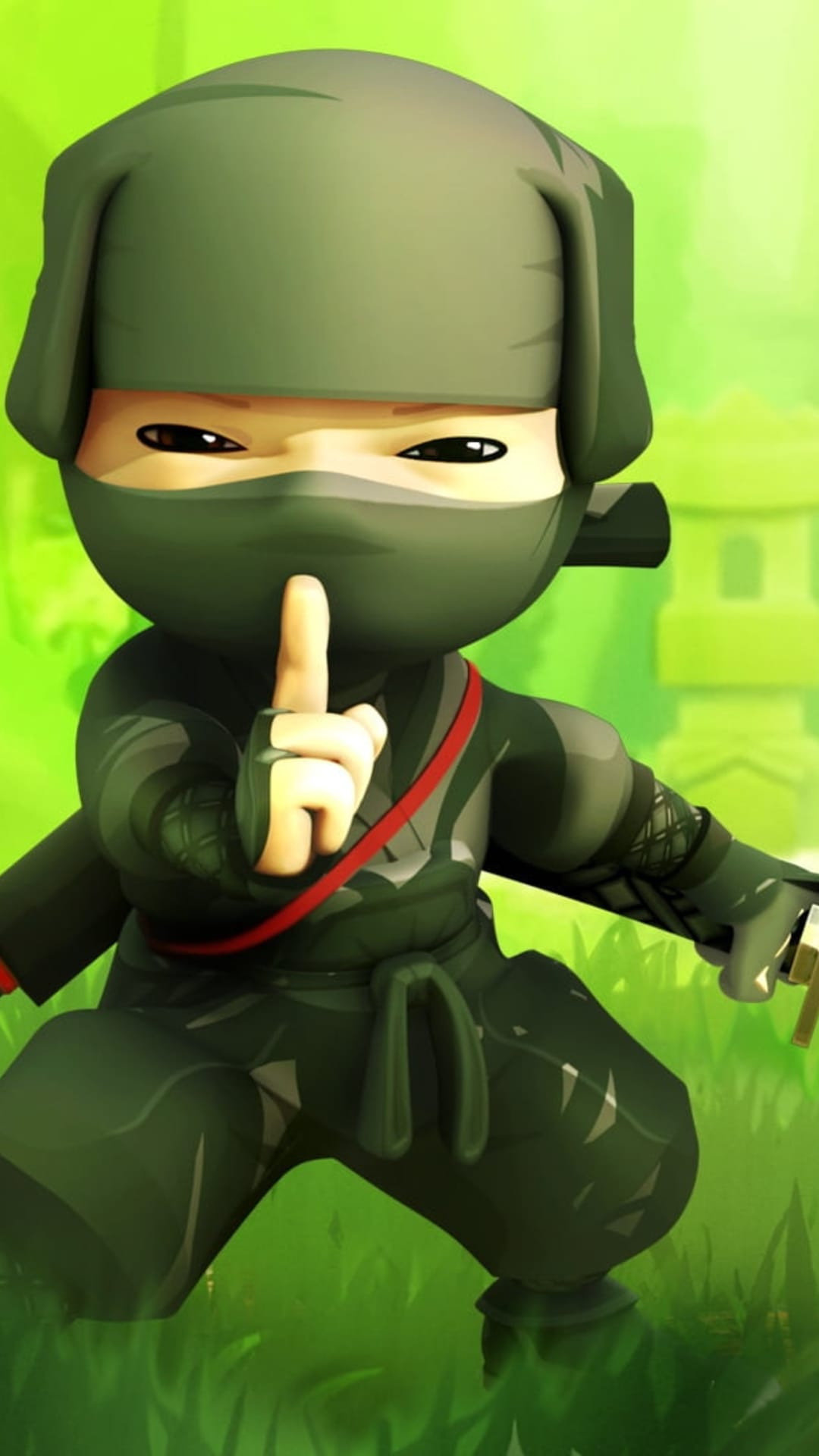 Tiny green ninja in a hood crouches on grass with a finger to its lips near a blurry Japanese stone lantern.