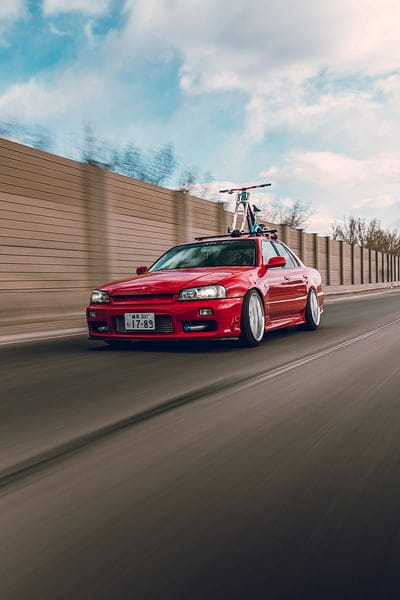 nissan r34, nissan, car, red, speed, road, mobile wallpaper, android wallpaper, iPhone wallpaper, phone wallpaper