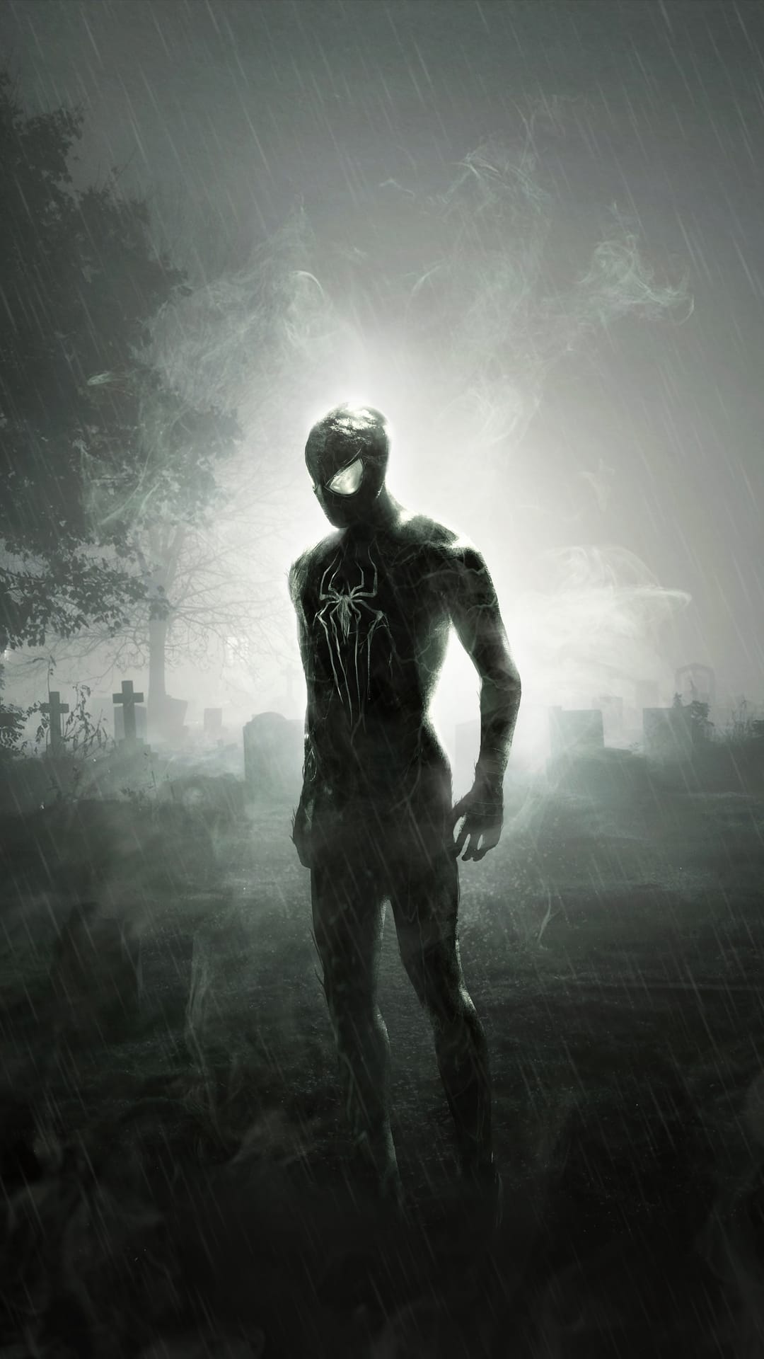 Spiderman in a black suit with a white logo stands in a foggy cemetery during a heavy rainstorm at night.