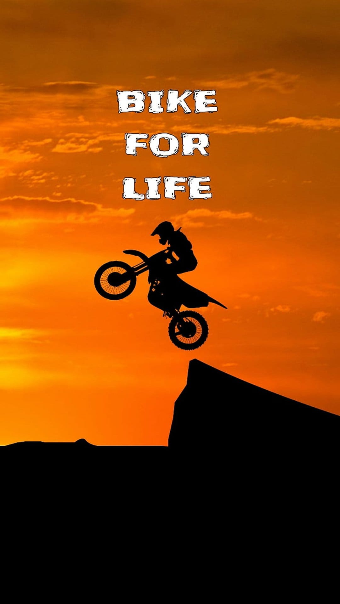 Motocross rider silhouette jumps between cliffs against a vibrant orange sunset with the text bike for life.