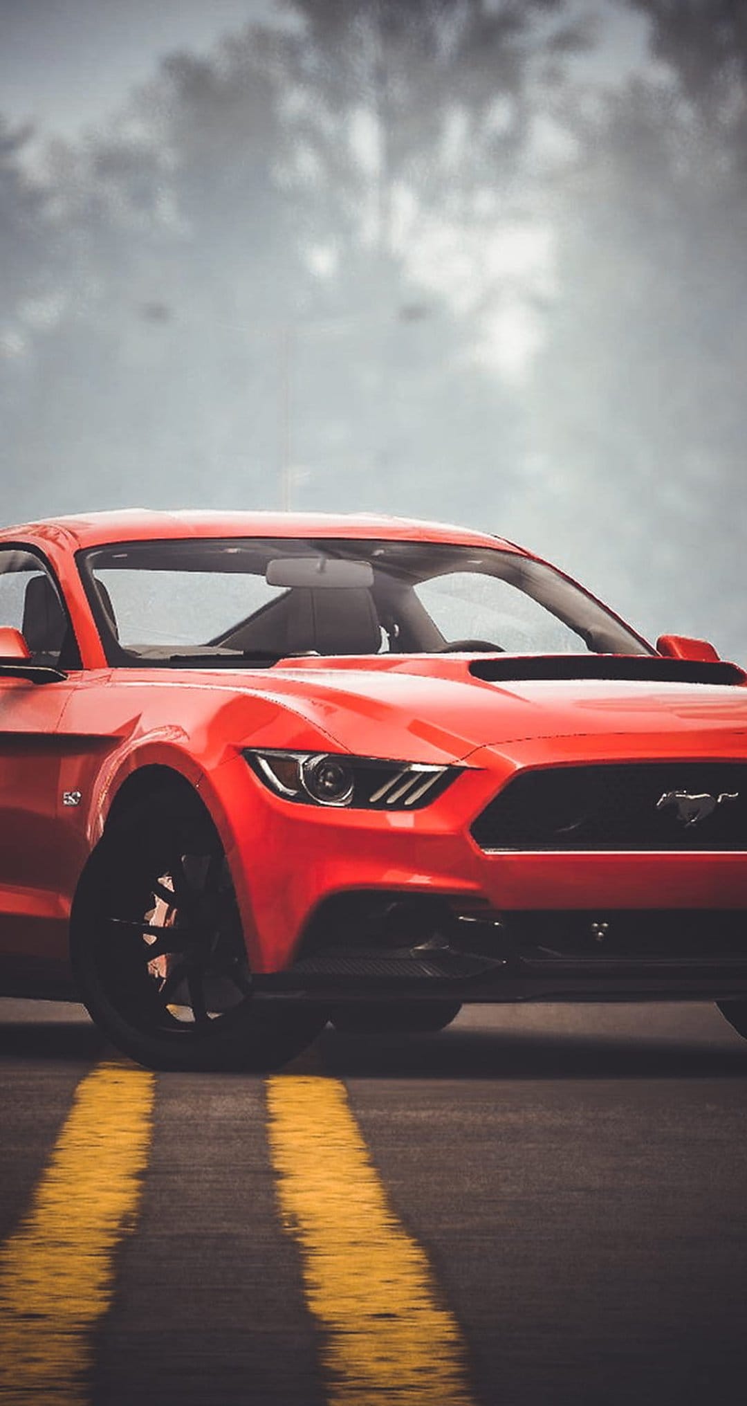 Red Ford Mustang GT parked on wet asphalt with blurred yellow lines under a moody, overcast sky at dusk.