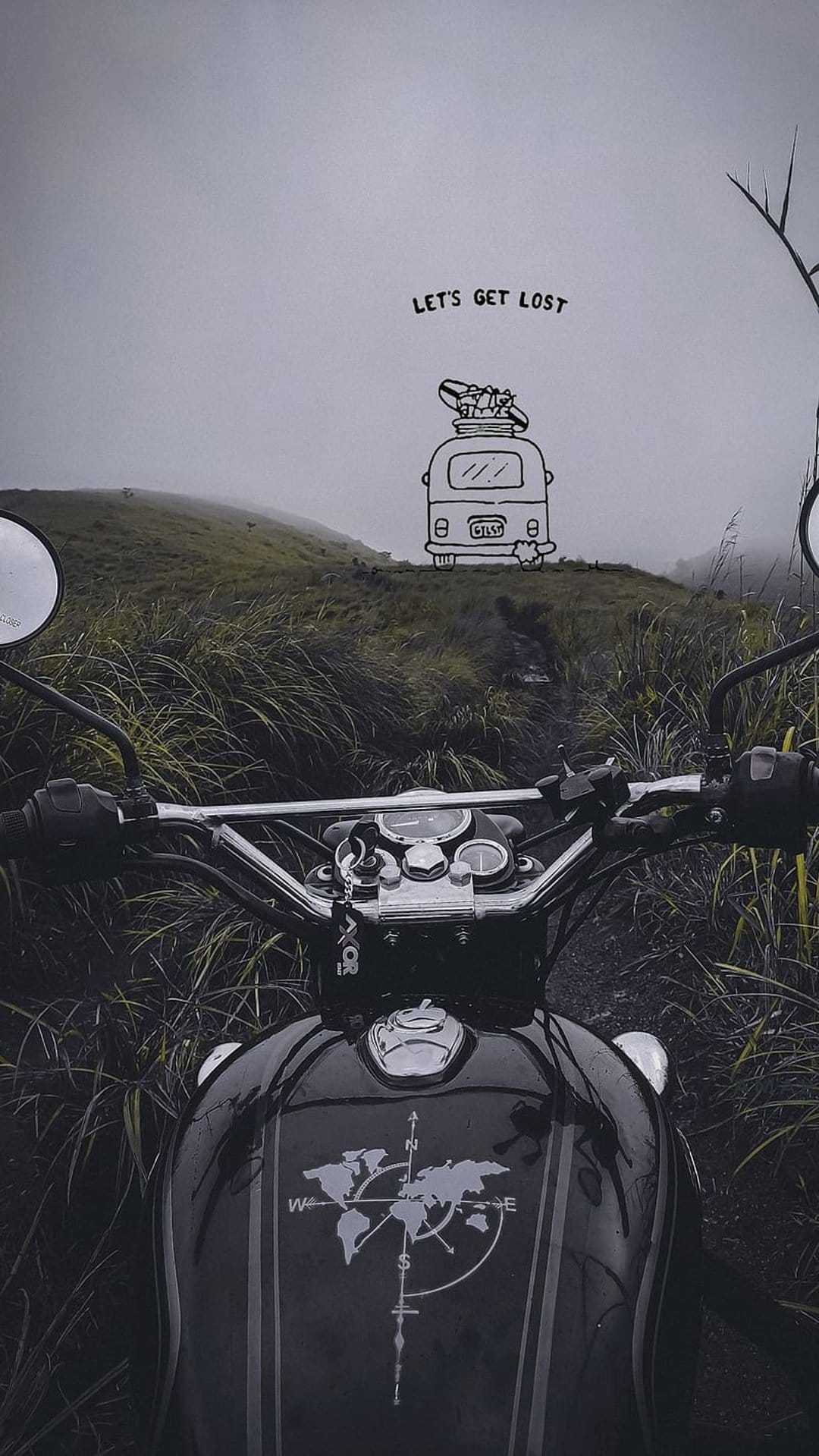 Motorcycle on a dirt trail overlooks misty mountains with a world map tank and a let's get lost graphic.