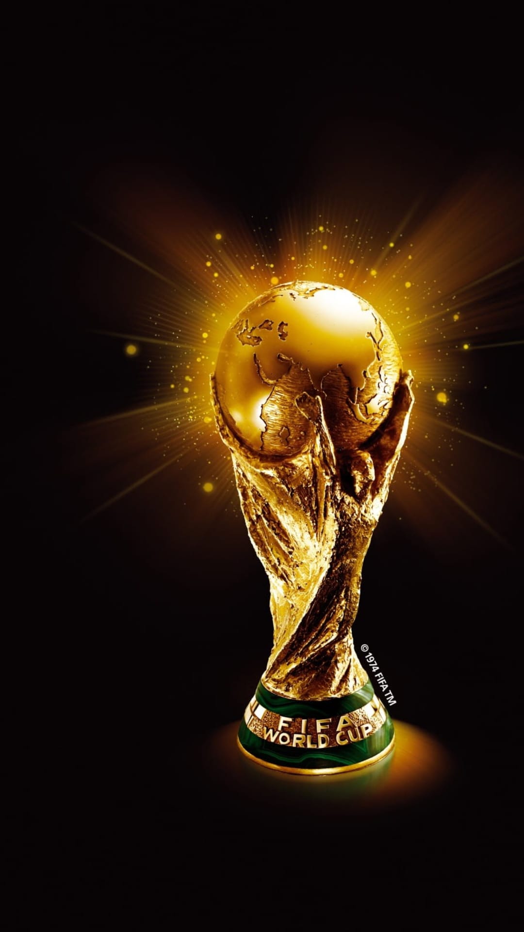 FIFA World Cup golden trophy shines with radiant light beams and particles against a dark vertical background.