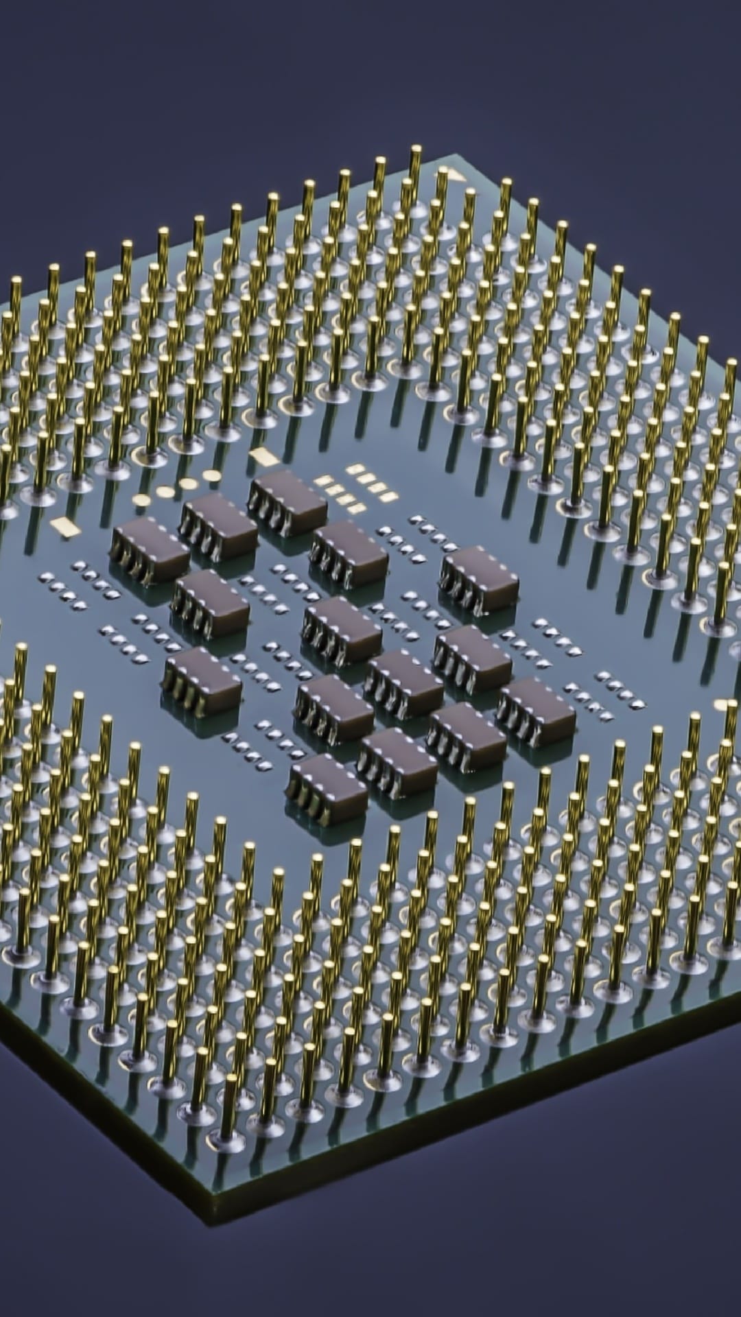 Gold processor pins extend from a green microchip in a macro perspective showing intricate circuit architecture.