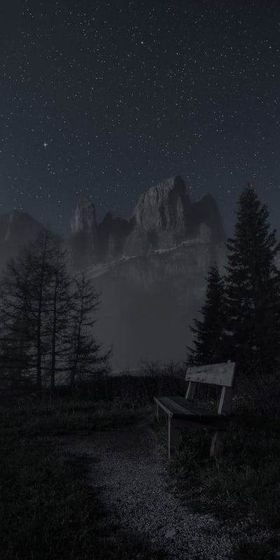 Night, Stars, Mountains, Bench, Nature, Landscape, Serene, Dark, Mysterious, Solitude, Pine trees, Misty, Twilight, Sky, Outdoors, Peaceful, Contemplation, Grandeur, Wilderness, Forest