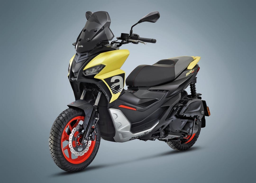Yellow and black Aprilia SR GT 200 sport scooter with red wheels shown on a clean neutral gray background.