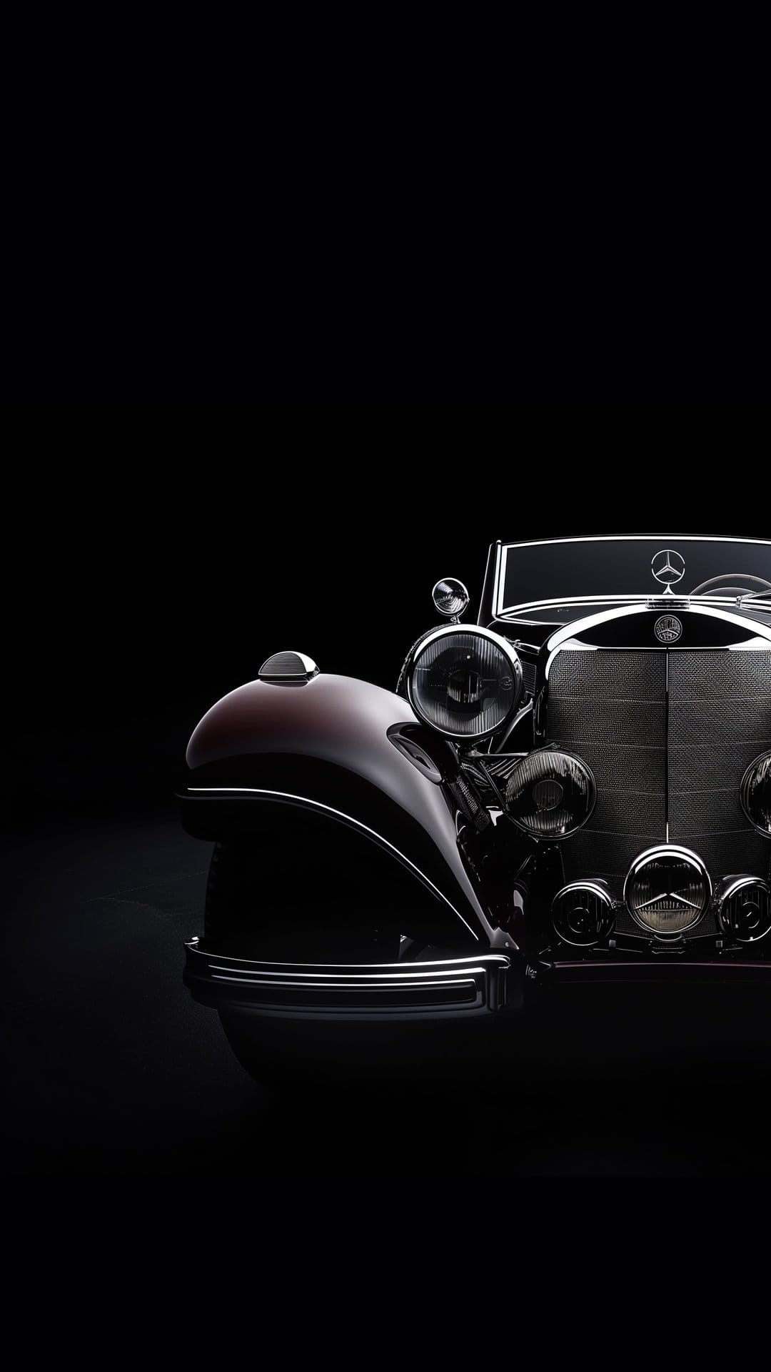 Vintage Mercedes-Benz convertible front view with shining chrome grille and headlights against a black background.