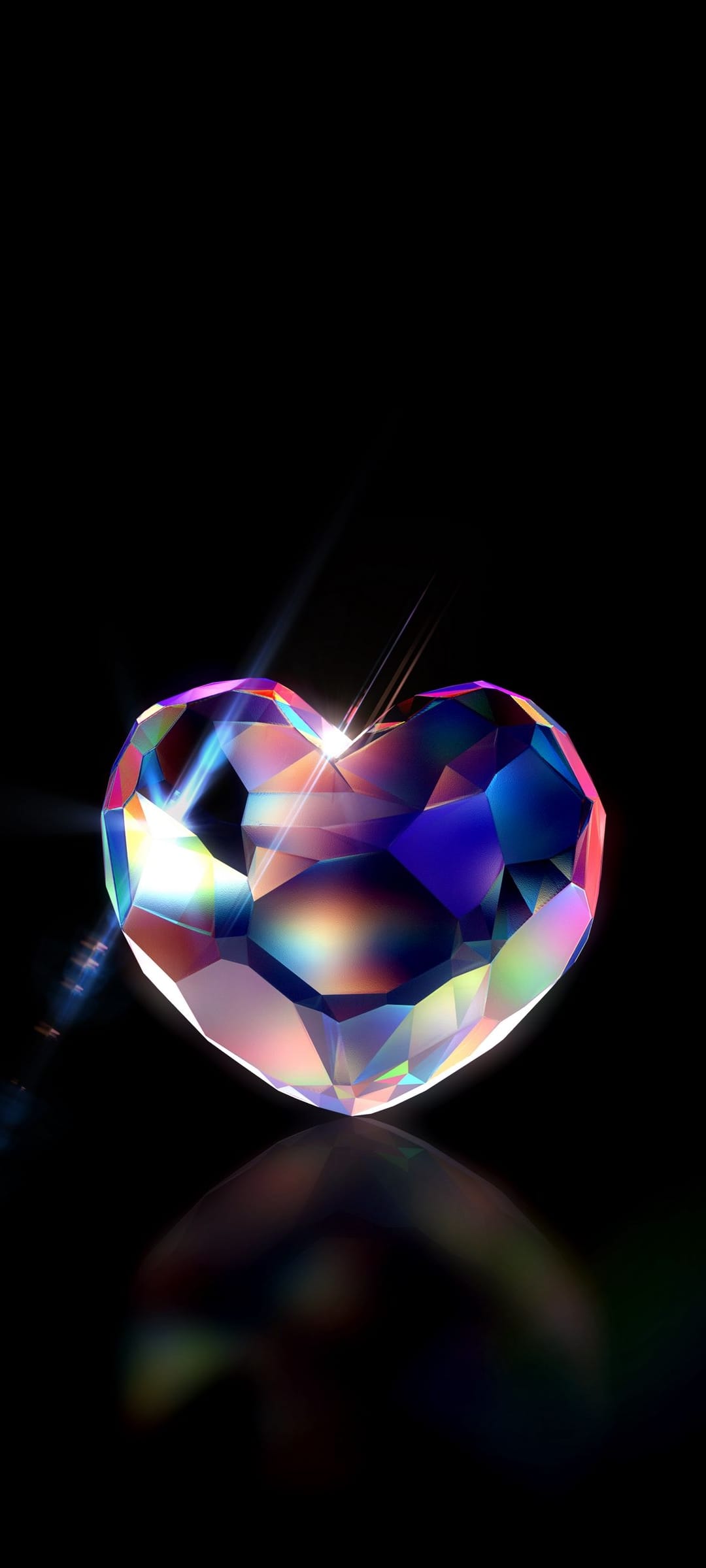 Heart-shaped diamond on a black surface refracting sharp beams of rainbow light with a clear mirrored reflection.