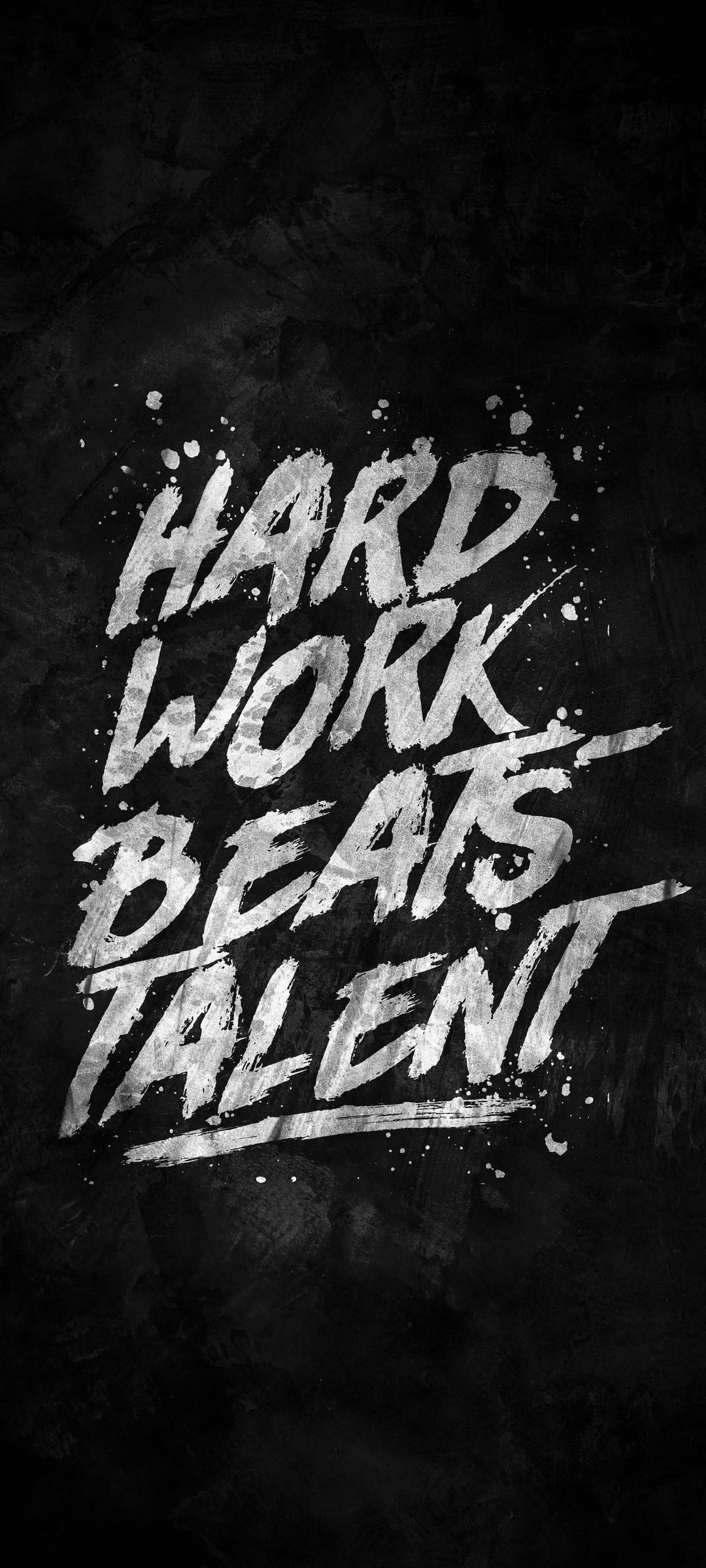 Hard Work Beats Talent quote in bold textured lettering centered on a dark high-contrast grunge background.