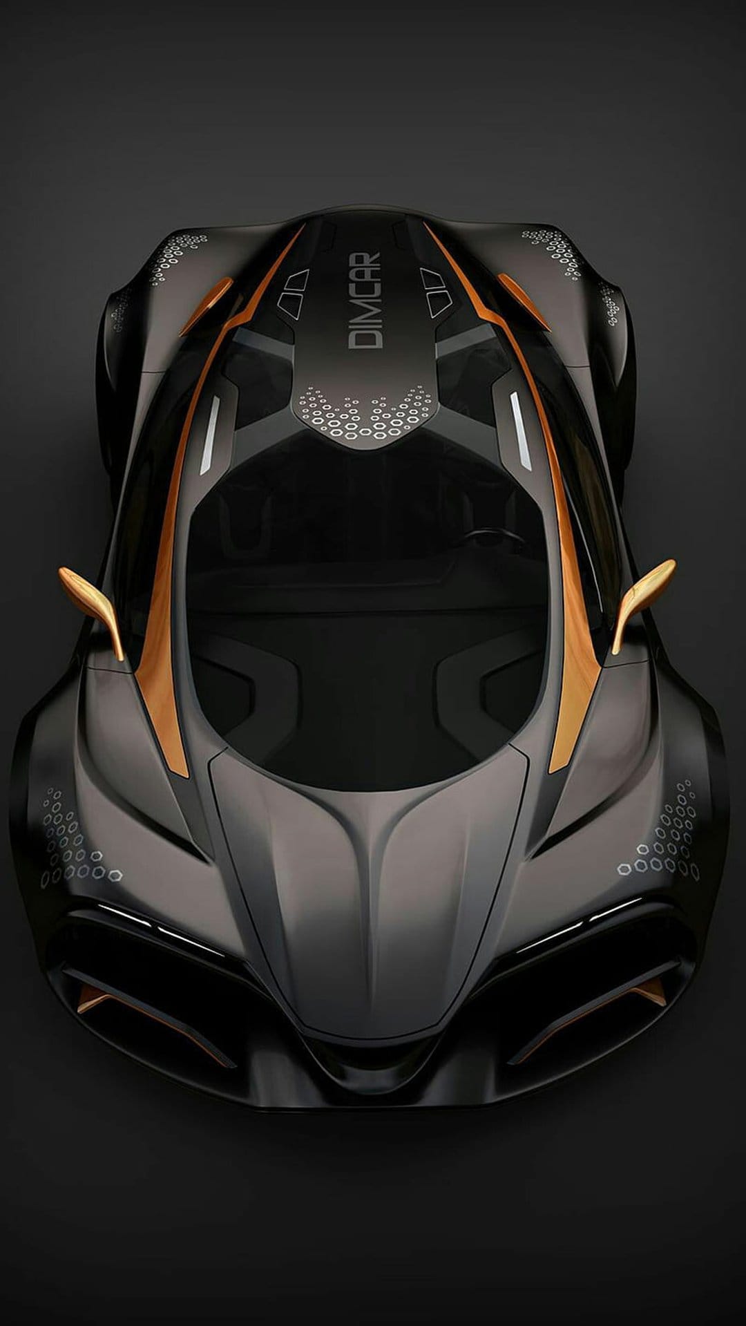 Dimcar concept car with black paint and gold detailing viewed from above showing circular hood patterns.
