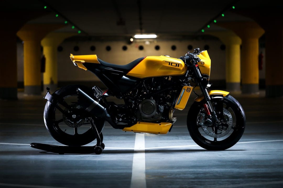 Yellow Husqvarna 701 Vitpilen motorcycle side profile in a dark parking garage with cinematic lighting.