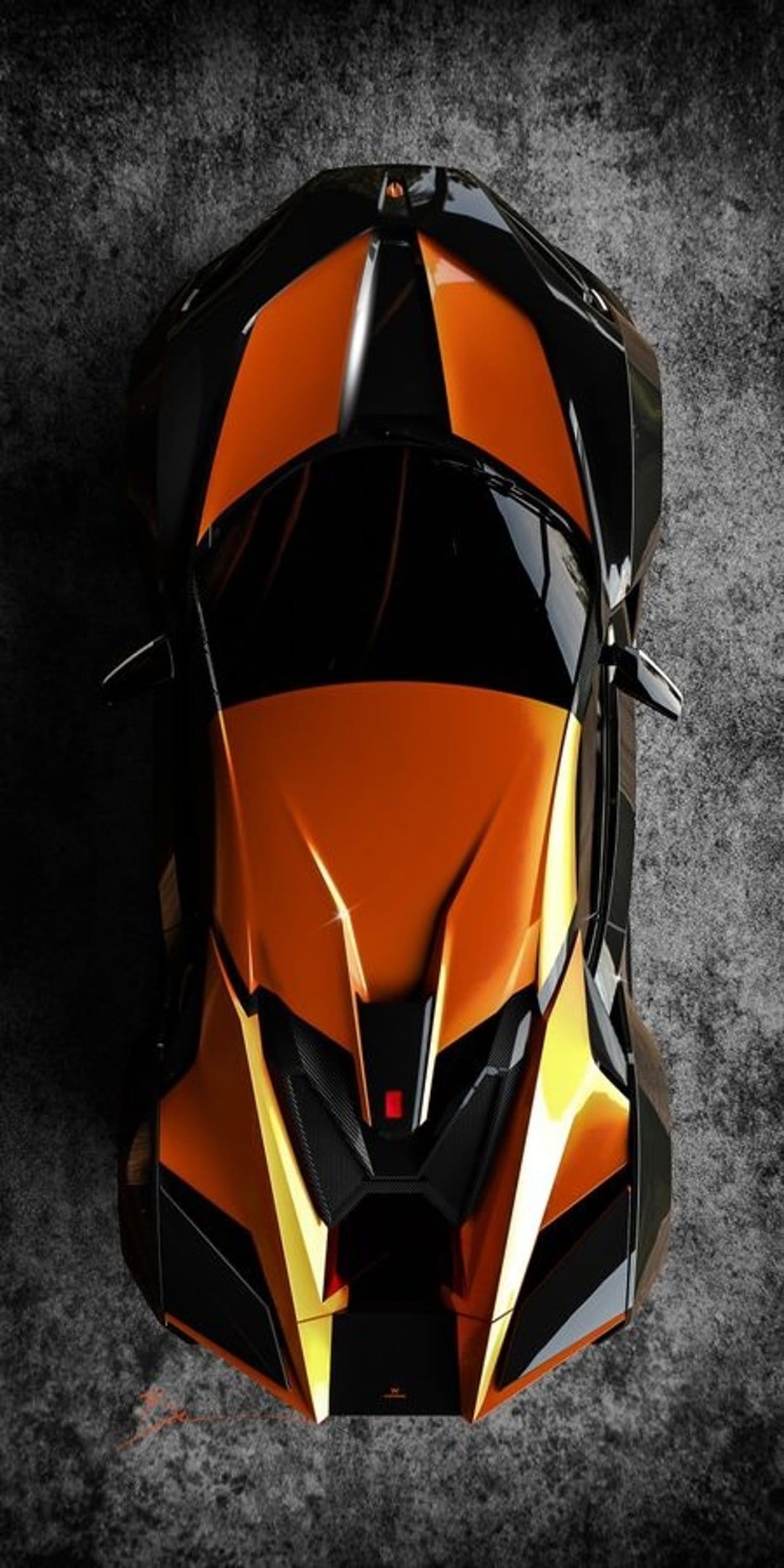 Black sports car with orange accents on a concrete surface shown from an overhead perspective in portrait view.