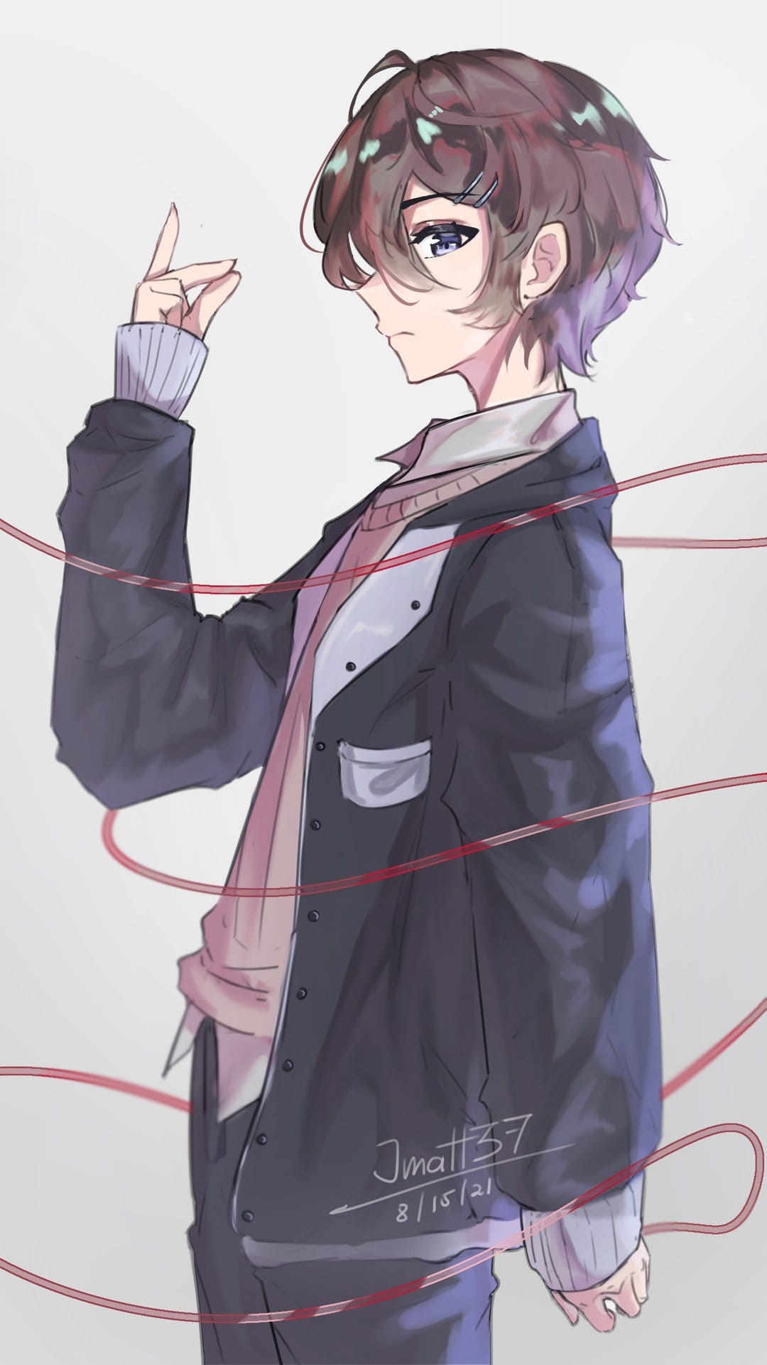 Young man with purple highlights bound by tangled red strings against a neutral gray vertical backdrop.