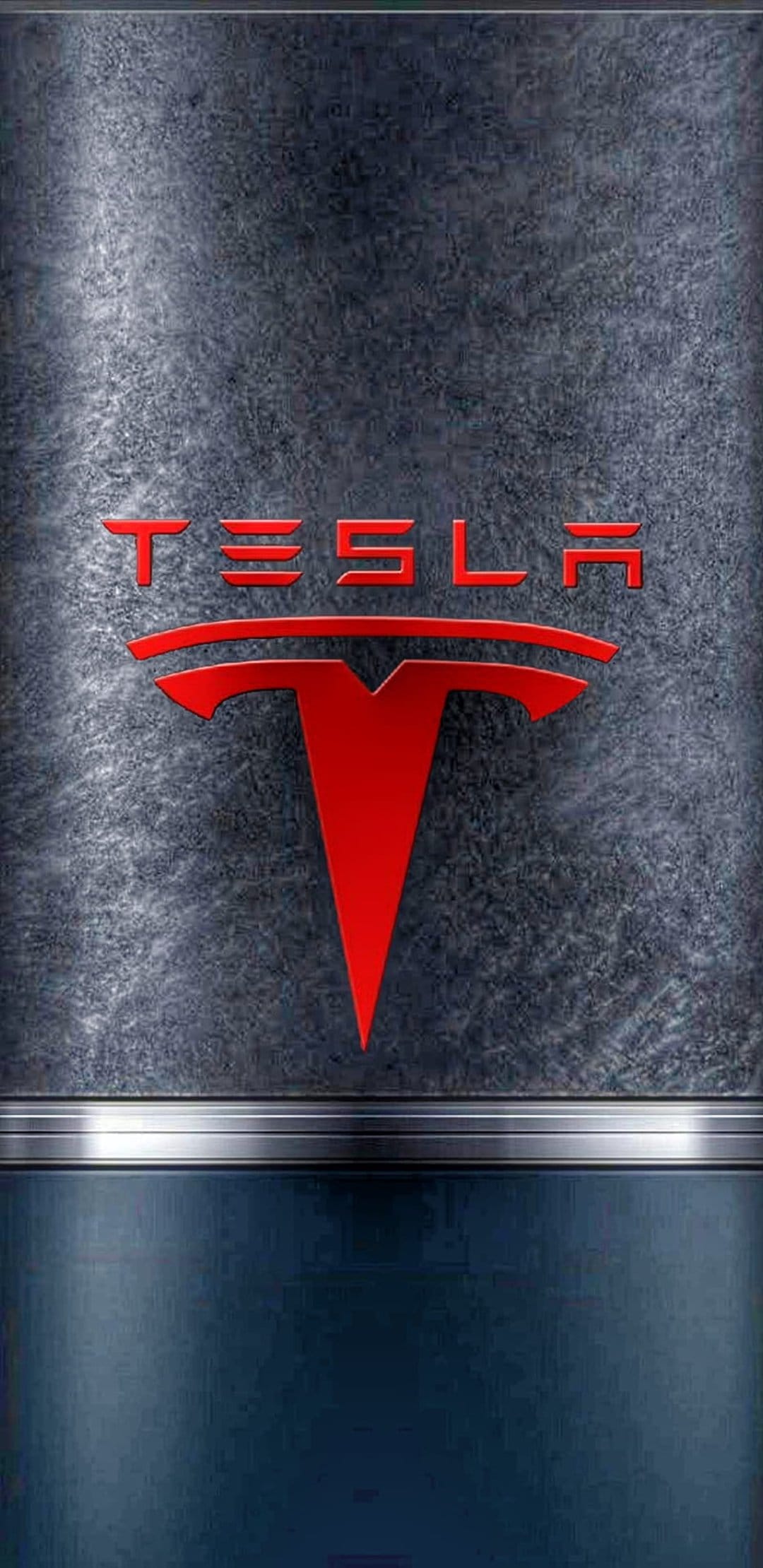Tesla logo in red chrome rests on a dark textured metal surface above a horizontal brushed silver divider strip.