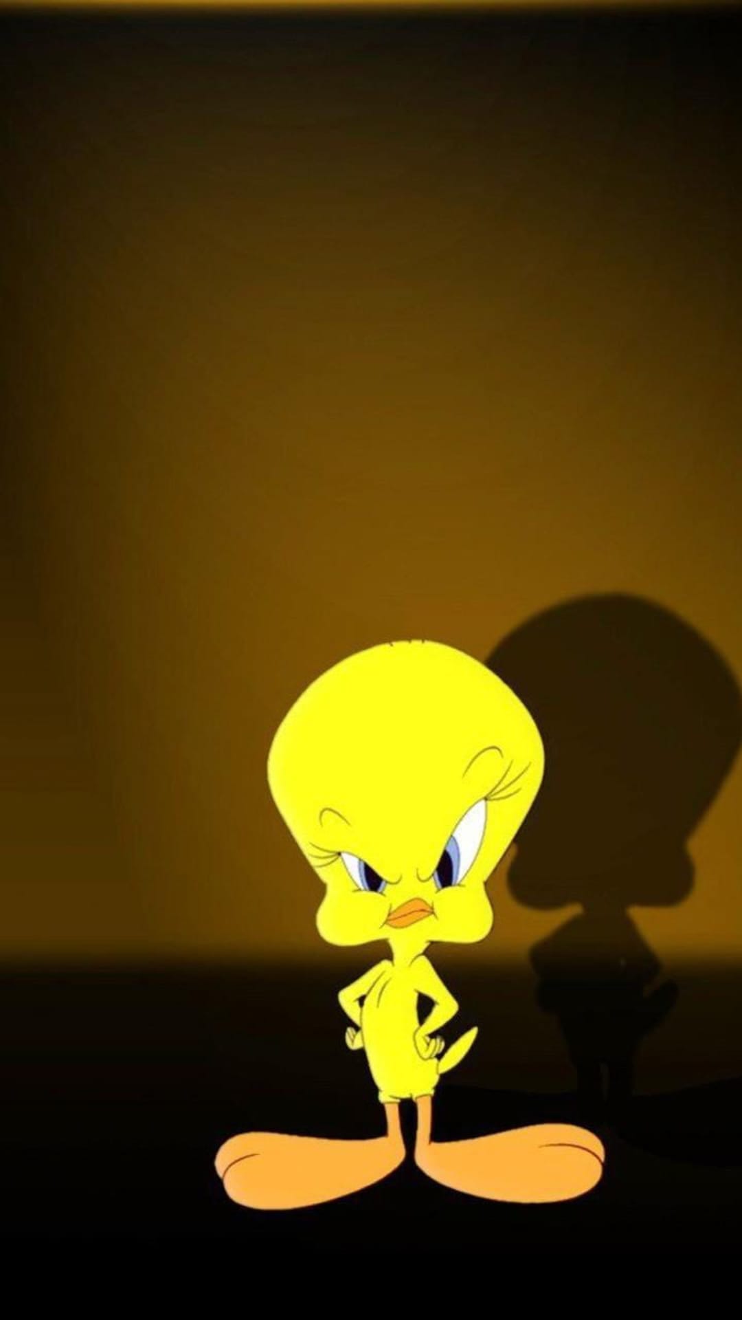 Tweety Bird stands with hands on hips before a large looming shadow against a dark textured background.
