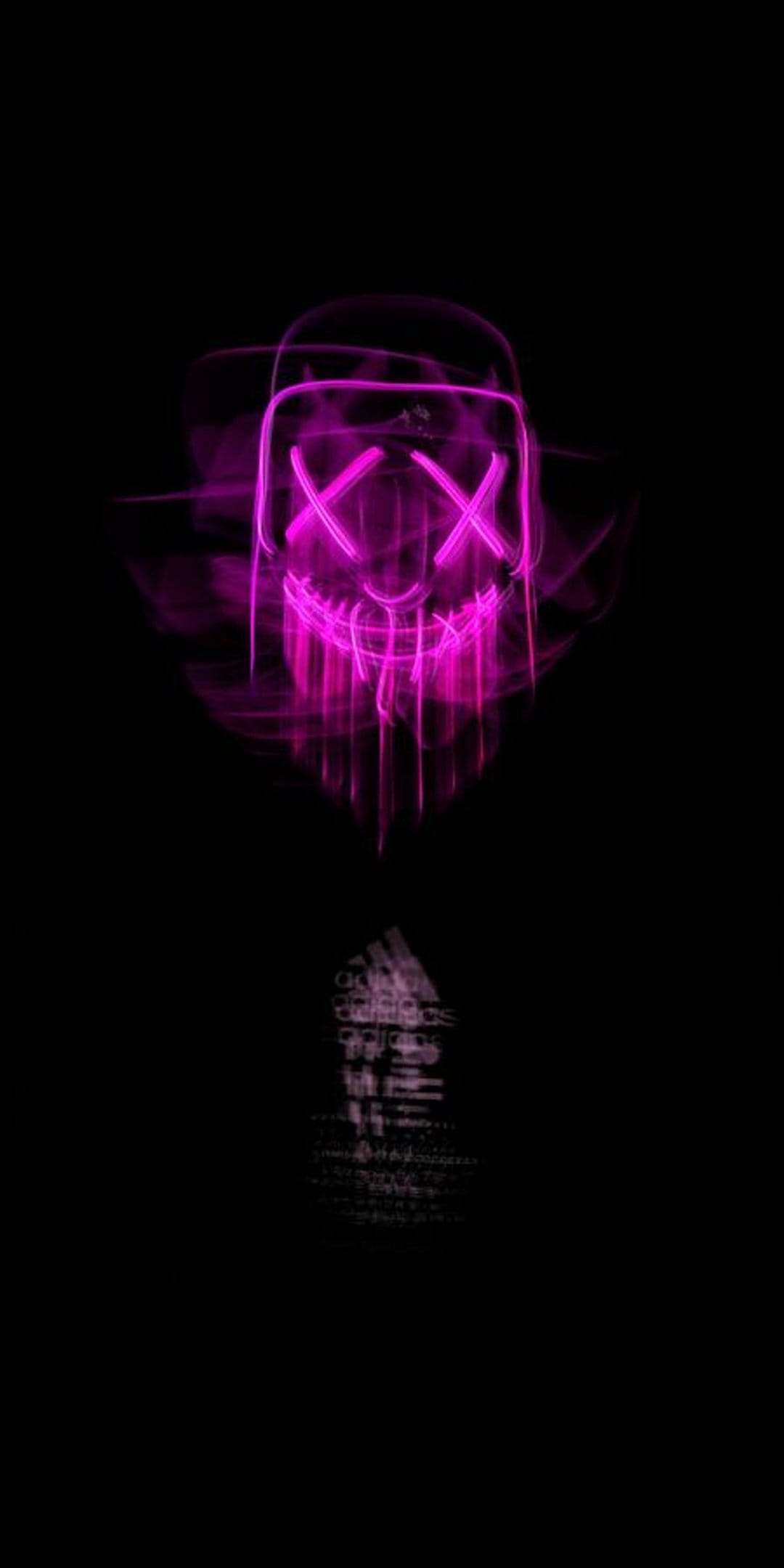 Glowing pink neon mask with X eyes and a jagged mouth dripping light set against a deep solid black background.