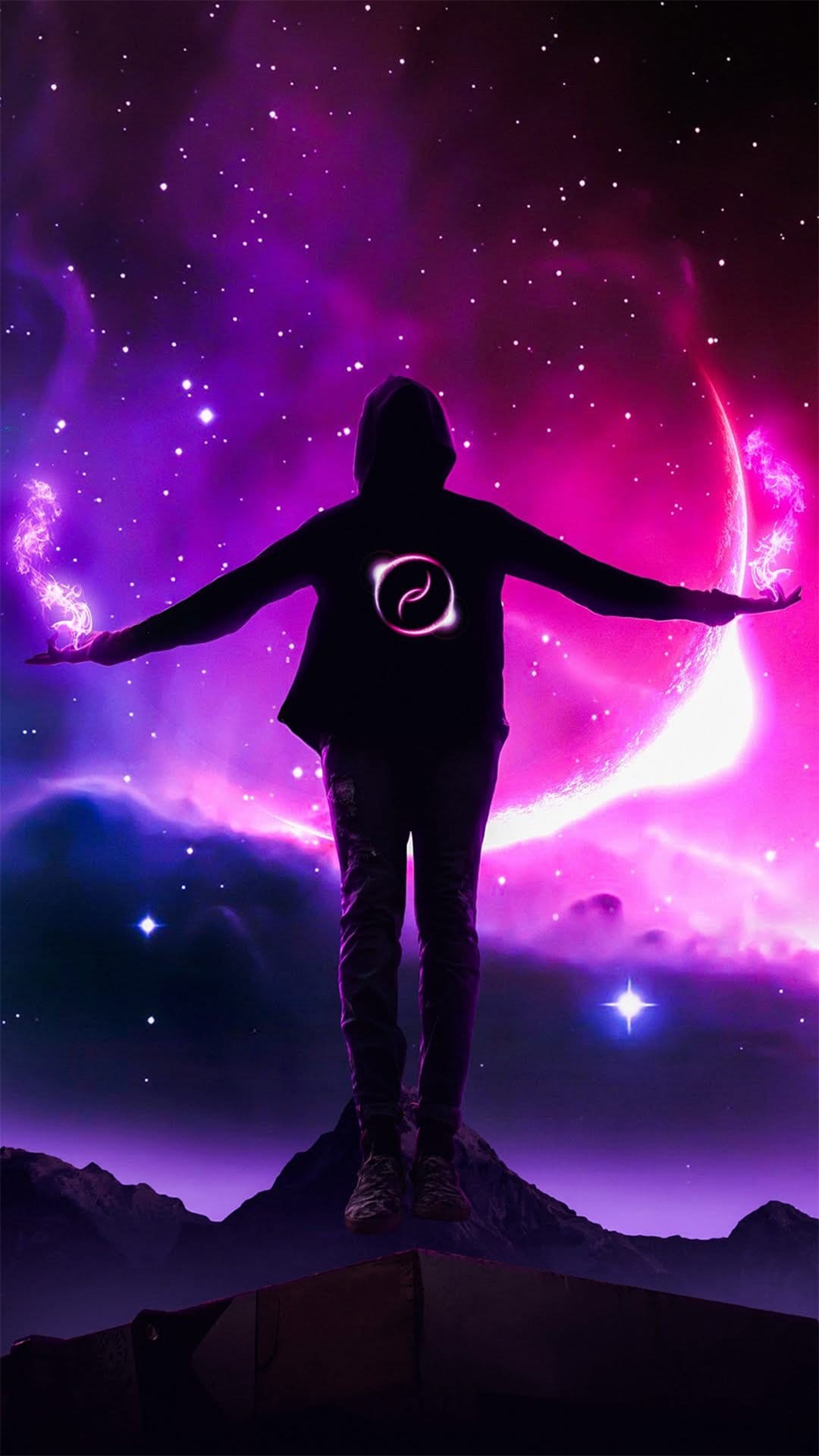 Hooded silhouette floats above mountains with purple energy palms against a pink nebula and crescent moon.