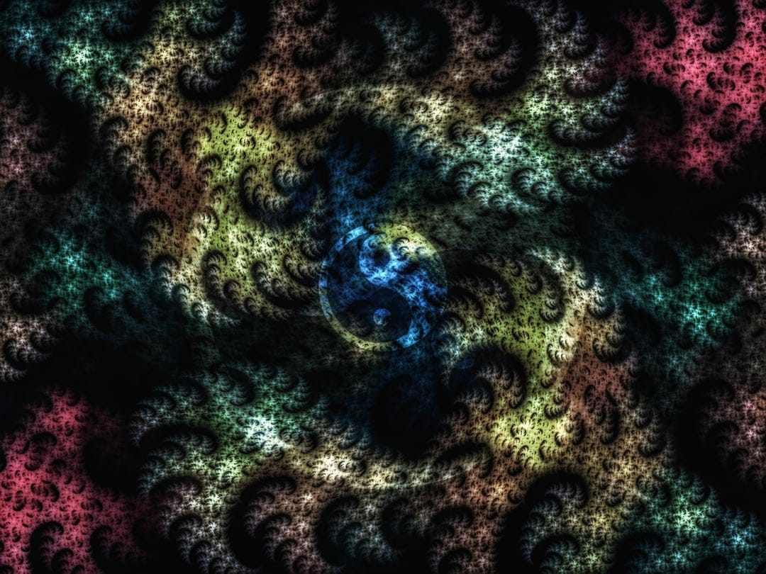 Yin Yang symbol centered within a multi-colored fractal vortex of neon blue, pink, and yellow light spirals.
