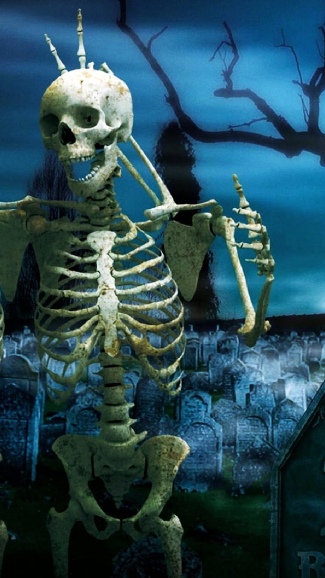 Skeleton making a peace sign in a moonlit graveyard with tombstones and a dead tree against a cloudy night sky.