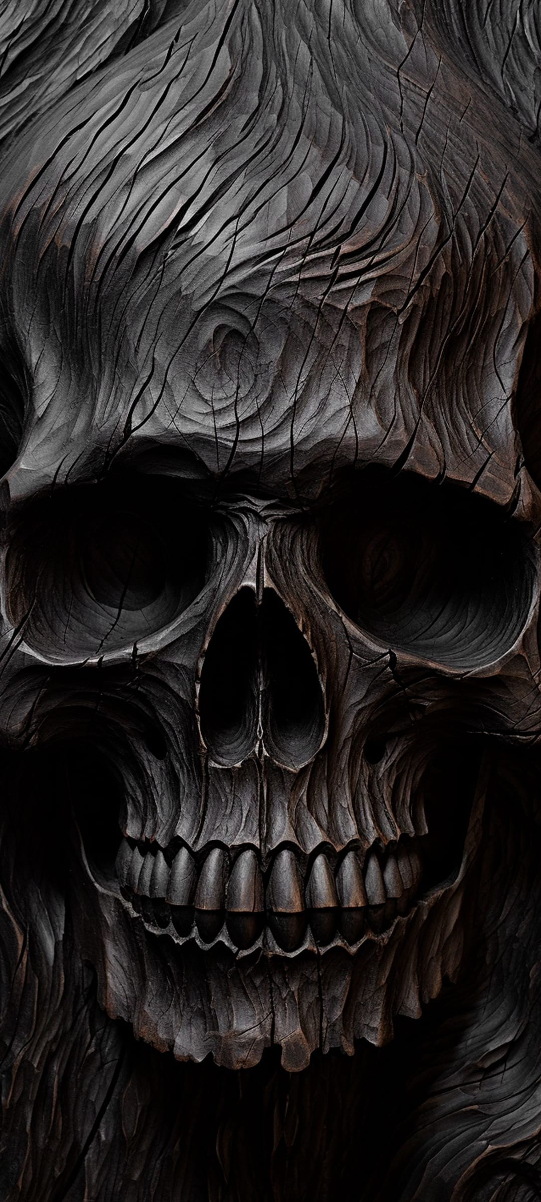 Wood-textured skull carving features intricate grain patterns and dark charcoal shadows in a close-up view.